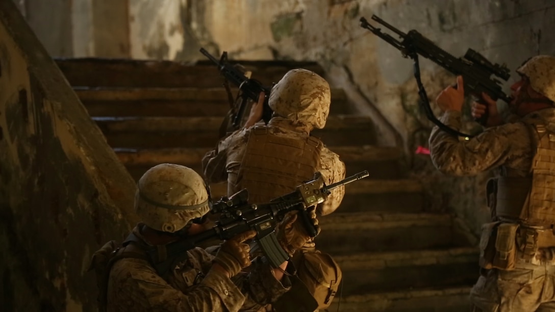 U.S. Marines make their way upstairs Sept. 20 during an island seizure exercise as part of Valiant Shield 2014. The compound was being held by soldiers with the Guam National Guard’s 1st Battalion, 294th Infantry Regiment who were role-playing as the opposing forces. The Marines are with. Company A, 1st Battalion, 3rd Marine Regiment, currently assigned to 3rd Marine Division, III Marine Expeditionary Force. (U.S. Marine Corps photo by Lance Cpl. Tyler Ngiraswei/ Released)