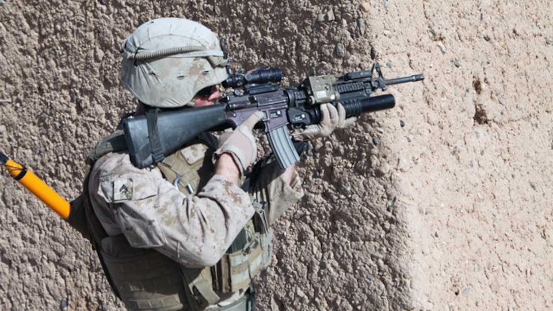 A Marine with Bravo Company, 1st Battalion, 2nd Marine Regiment, provides security during an operation in Helmand province, Sept. 9, 2014. During the 72-hour operation, Marines and Afghan National Army soldiers conducted dismounted patrols on foot to search nearby compounds for weapons and lethal aid. (U.S. Marine Corps photo by Cpl. Cody Haas/ Released)