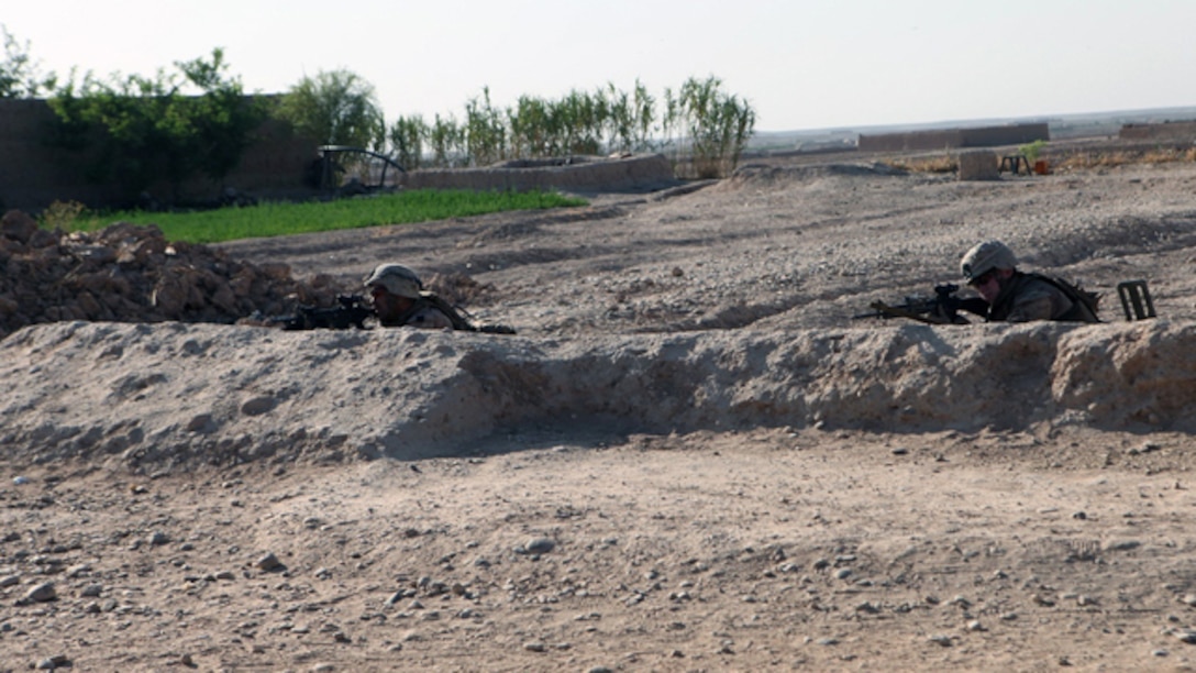Marines with Bravo Company, 1st Battalion, 2nd Marine Regiment, provide security during an operation in Helmand province, Sept. 9, 2014. During the 72-hour operation, Marines and Afghan National Army soldiers conducted dismounted patrols on foot to search nearby compounds for weapons and lethal aid. (U.S. Marine Corps photo by Cpl. Cody Haas/ Released)