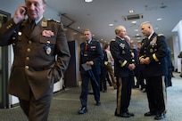 Army Gen. Martin E. Dempsey, chairman of the Joint Chiefs of Staff, center, talks with Army Gen. John Campbell, commander of the International Security Assistance Force in Afghanistan, right, between sessions of the NATO Military Committee conference in Vilnius, Lithuania, held Sept. 20-21, 2014.