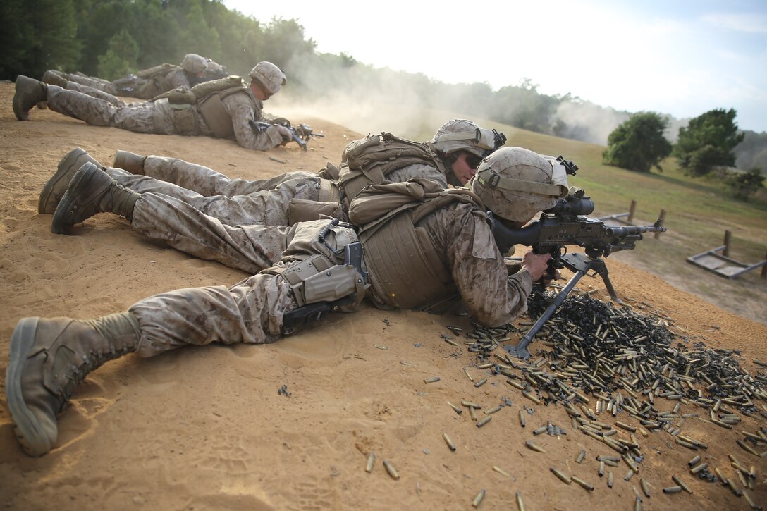 Machine gunners with 3rd Battalion, 2nd Marine Regiment, fire on a mock enemy bunker and provide suppressive fire for an assault team during a live-fire exercise on Range P28 aboard Fort A.P. Hill, Va., Sept. 5. The range was built specifically for the unit as a training aid to increase overall unit readiness. 