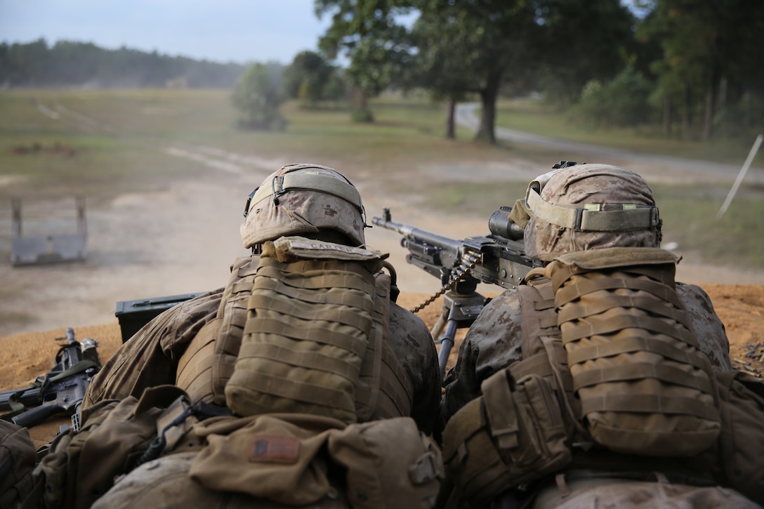 Machine gunners with 3rd Battalion, 2nd Marine Regiment, fire on a mock enemy bunker and provide suppressive fire for an assault team during a live-fire exercise on Range P28 aboard Fort A.P. Hill, Va., Sept. 5. The range was built specifically for the unit as a training aid to increase overall unit readiness. 