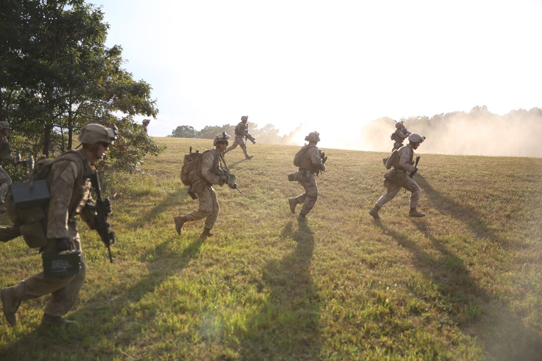 Machine -gunners with 3rd Battalion, 2nd Marine Regiment, assault an enemy objective during a live-fire training exercise on Range P28 aboard Fort A.P. Hill, Va., Sept. 5. The range was built specifically for the unit as a training aid to increase overall unit readiness. 