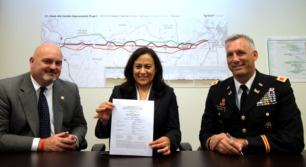 Commissioner Charlie Kilpatrick, Virginia Department of Transportation, Irene Rico, U.S. Department of Transportation Federal Highway Administration division administrator, and Col. Paul Olsen, commander of U.S. Army Corps of Engineers' Norfolk District signed the U.S. Route 460 draft Supplemental Environmental Impact Statement, Sept. 18, in Suffolk, Va. The public comment period for the draft SEIS ends Nov. 17. 