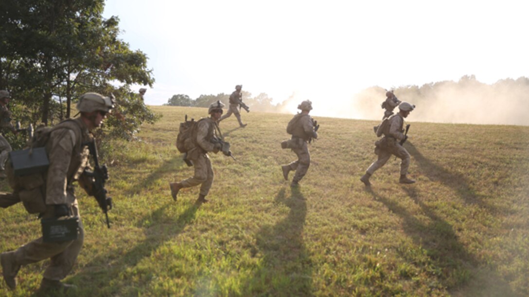 Machine-gunners with 3rd Battalion, 2nd Marine Regiment, assault an enemy objective during a live-fire training exercise on Range P28 aboard Fort A.P. Hill, Va., Sept. 5. The range was built specifically for the unit as a training aid to increase overall unit readiness. (U.S. Marine Corps photo by Cpl. Jorden M. Wells/Released)