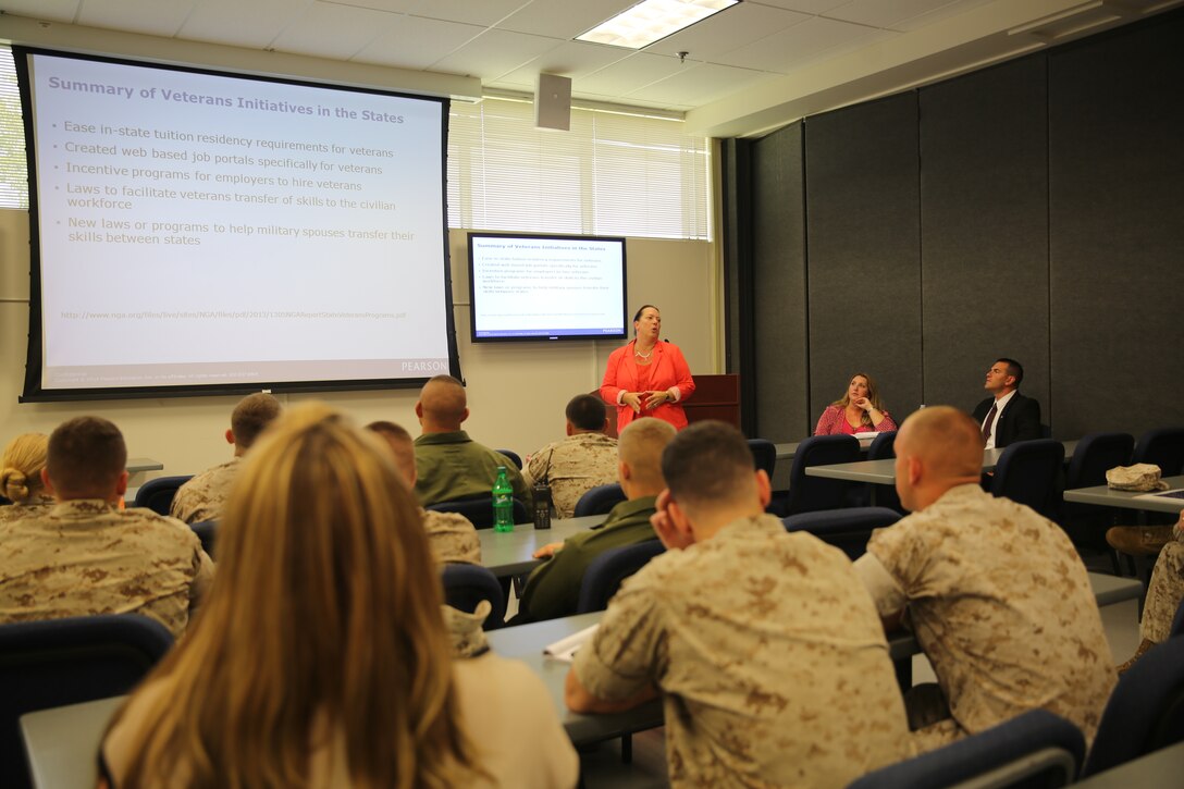 Marines, Sailors and civilians sit in a presentation during the Pearson VUE Lunch and Learn Event at the Jerry Marvel Training and Education Building at Marine Corps Air Station Cherry Point , N.C., Sept. 16, 2014.
