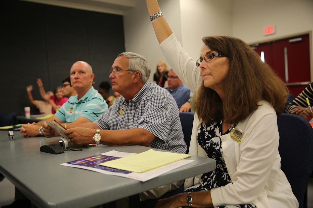 Participants interact with instructors and respond to questions during the Pearson VUE Lunch and Learn Event at the Jerry Marvel Training and Education Building at Marine Corps Air Station Cherry Point N.C., Sept. 16, 2014.