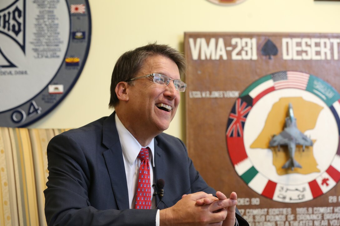 North Carolina Governor Pat McCrory smiles as he talks to media following his address to state dignitaries and leadership from Marine Corps Air Station Cherry Point, N.C., and 2nd Marine Aircraft Wing during the North Carolina Military Affairs Commission meeting held at Miller’s Landing Sept. 16, 2014.