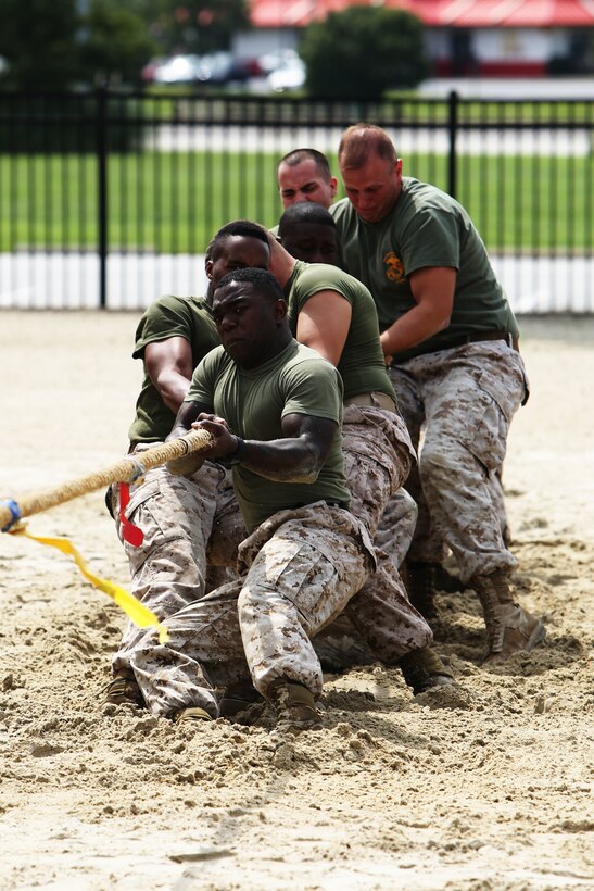 Marines with Headquarter and Headquarters Squadron’s Installation Personnel Administration Center team dig in during a tug of war match at Marine Corps Air Station Cherry Point Sept. 19, 2014. The IPAC team reached the semi-finals during the double elimination Combined Federal Campaign Cup tournament, losing to Marine Wing Support Squadron 271.