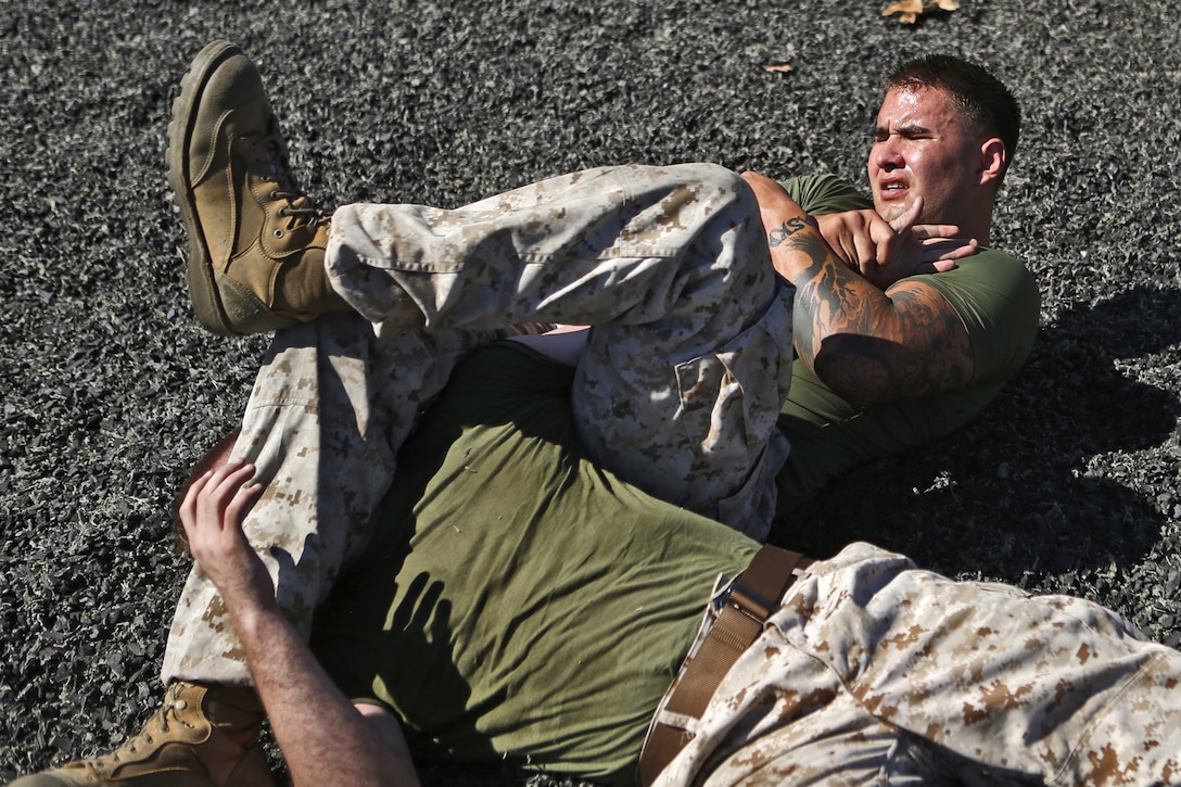 Lance Cpl. Sheldon D. Vogt, right, a machinegunner with 2nd Battalion, 1st Marine Regiment, 1st Marine Division, attempts an armbar on Cpl. Sean Cooley, left, team captain of the Headquarters and Support Battalion, Marine Corps Base Camp Pendleton, Marine Corps Installations - West, while training to prepare for the upcoming Commanding General’s Cup grappling tournament at the Paige Fieldhouse, Oct. 29.

“The tournament is based on the United World Wrestling rules,” said Jon Frank, event coordinator for the tournament. “Contestants gain points for scoring takedowns, obtaining dominant positions and can win matches by submitting their opponents.”

For more information on the CG’s cup grappling tournament and details on how to participate, please contact MCCS Intramural Sports Office at 760-763-0453.