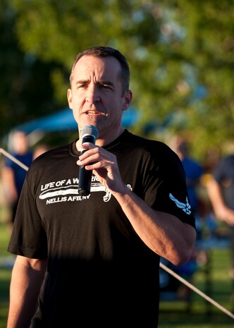 Col. Robert Ramsden, 99th Air Base Wing vice commander, speaks to Nellis Airmen before the Air Force birthday 5K run in front of the Warrior Fitness Center, Nellis Air Force Base, Nev., Sept. 18, 2014. The 5K run was held to celebrate the 67th birthday of the Air Force. (U.S. Air Force photo by Airman 1st Class Thomas Spangler)