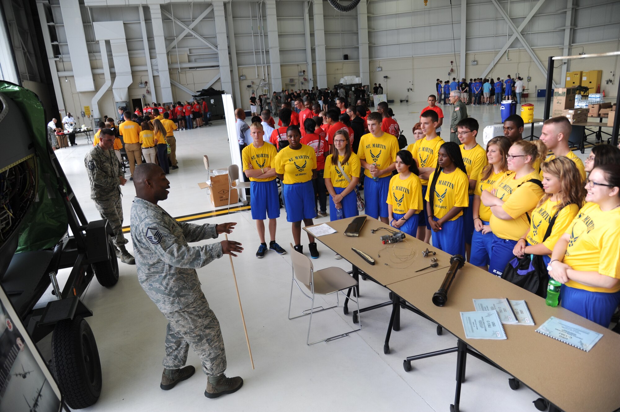 Master Sgt. Donald Maloid, 403rd Maintenance Squadron, briefs on the duties of  the Hurricane Hunters, to St. Martin High School Junior ROTC students during STEM (science, technology, engineering and mathematics) Diversity Outreach Day Sept. 19, 2014, at the fuel cell hangar, Keesler Air Force Base, Miss.  The event consisted of 10 Mississippi gulf coast high school JROTC units visiting informative booths about Air Force opportunities and accession requirements with an emphasis on STEM.  (U.S. Air Force photo by Kemberly Groue)