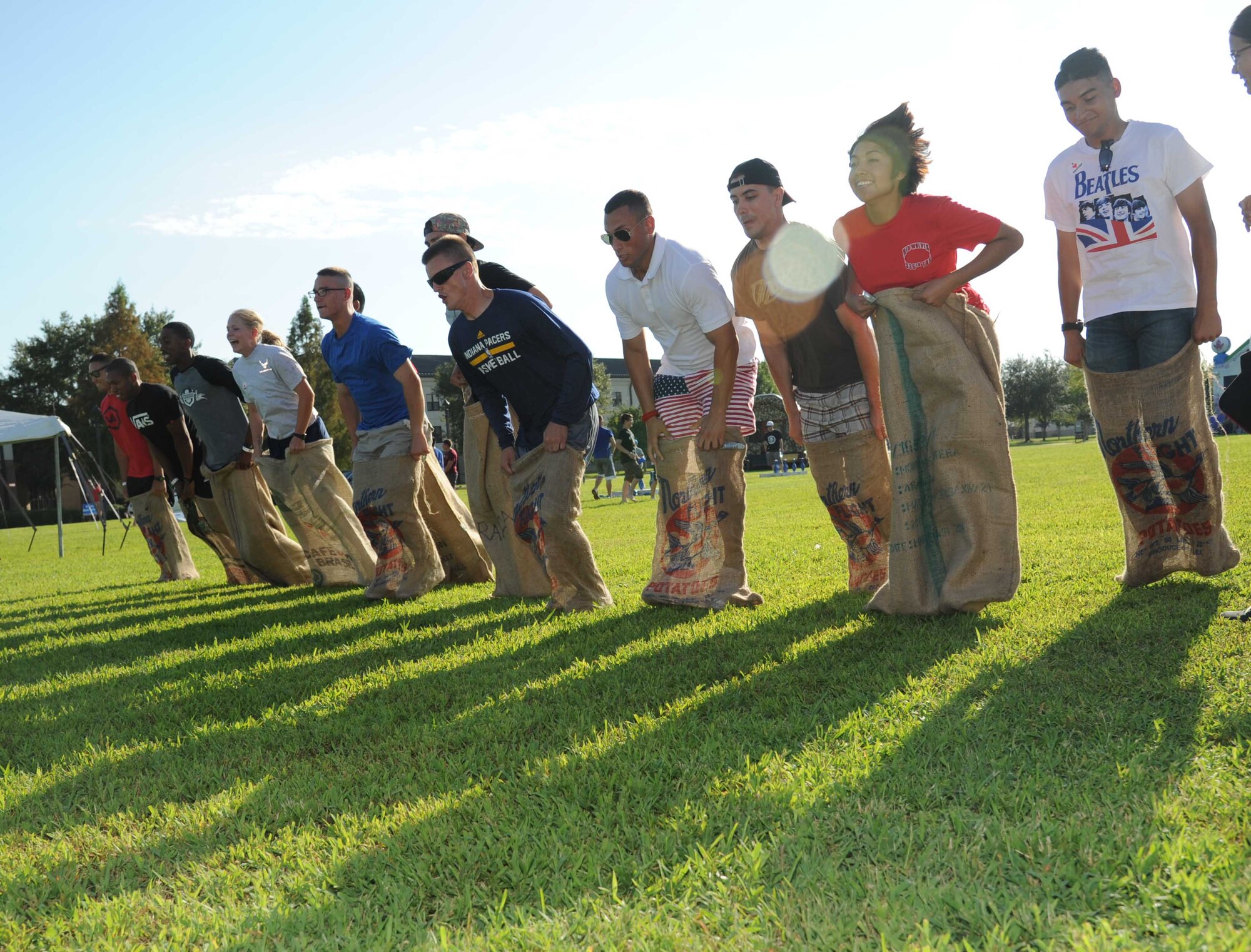Airmen compete in the potato sack contest during the Air Force’s 67th birthday celebration Sept. 19, 2014, Keesler Air Force Base, Miss. The event also included a cake cutting ceremony, music, games, contests and food. (U.S. Air Force photo by Kemberly Groue)
