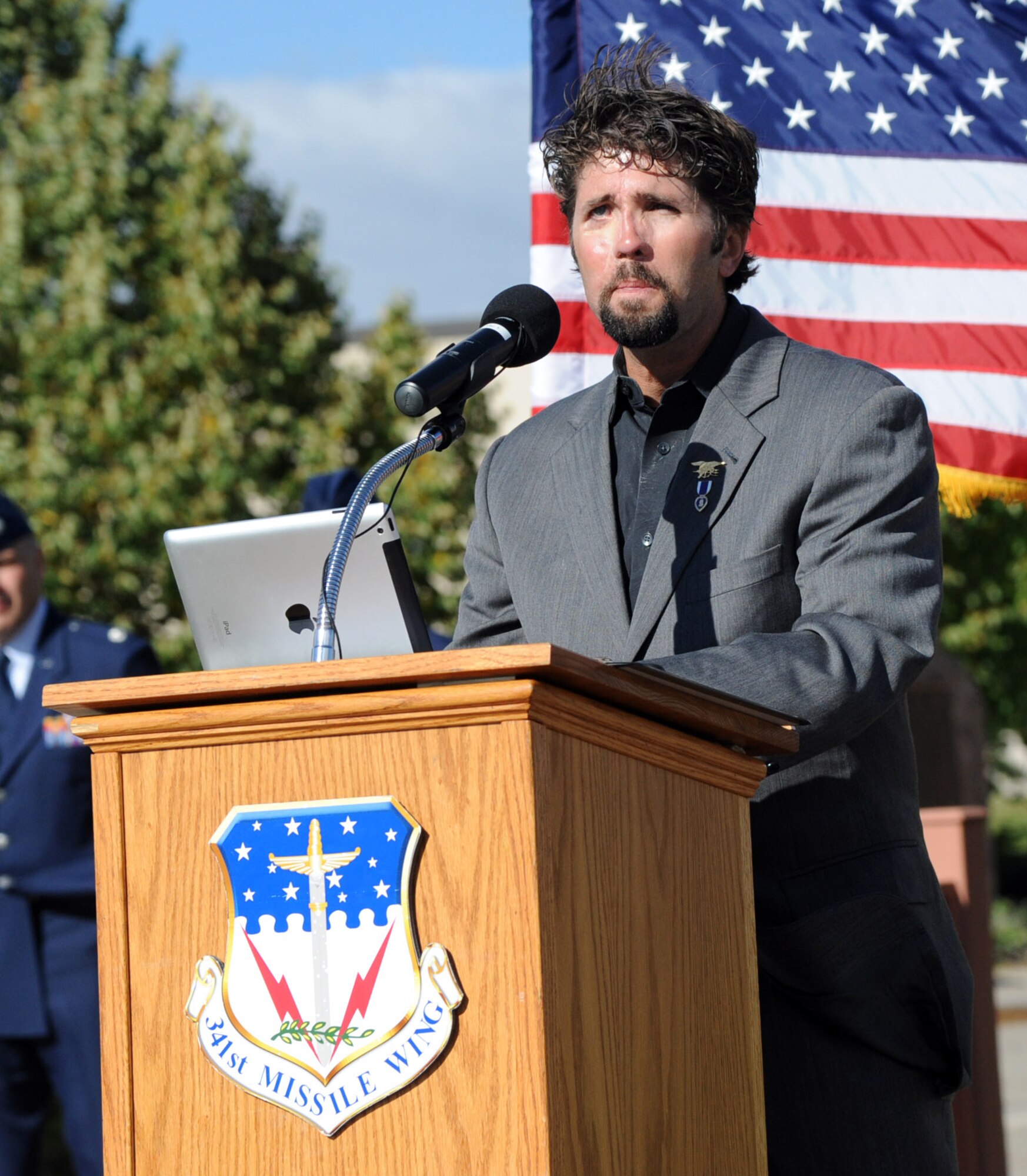 Retired Lt. Jason Redman, former U.S. Navy SEAL, speaks during a Prisoner of War/Missing in Action recognition retreat ceremony at the Medal of Honor Park on Malmstrom Air Force Base Sept. 19. In September 2007, while acting as assault force commander to capture an Al Qaeda high value individual, Redman’s assault team came under heavy machine gun and small arms fire and he was severely wounded in the ensuing firefight. After 37 surgeries, Redman uses his positive attitude to motivate others and raise awareness of the sacrifices of America’s military forces and their families. (U.S. Air Force photo/Airman 1st Class Joshua Smoot)