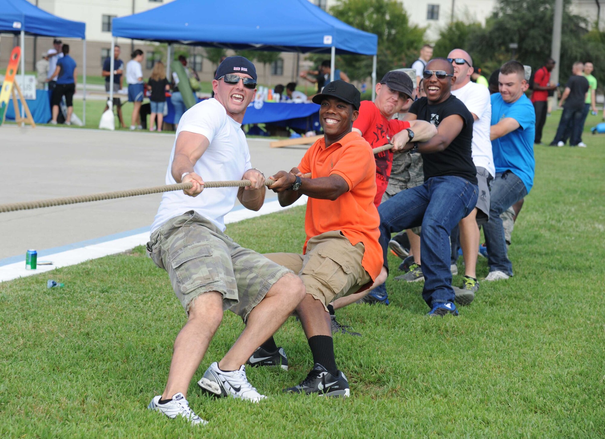 Airmen 1st Class John Boswell and Michael Barnes, 338th Training Squadron; Airmen 1st Class Jack Hansen and Jaren Kirkendoll, 335th Training Squadron; Airman 1st Class John Spencer and Airman Basic Charles Lollar, 338th TRS, pull on their side of the rope in a game of tug-of-war during the Air Force’s 67th birthday celebration Sept. 19, 2014, Keesler Air Force Base, Miss. The event also included a cake cutting ceremony, music, games, contests and food.  (U.S. Air Force photo by Kemberly Groue)