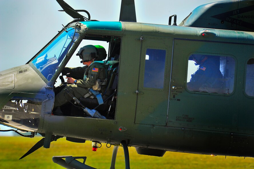 Members of the 54th Helicopter Squadron prepare for take off on Minot Air Force Base, N.D., Aug. 13, 2014.  The 54th HS team will compete against teams from F.E. Warren AFB, Wyo. and Malmstorm AFB, Mont. for the Bourland Trophy during the Global Strike Challenge. (U.S. Air Force photo/Senior Airman Brittany Y. Bateman)