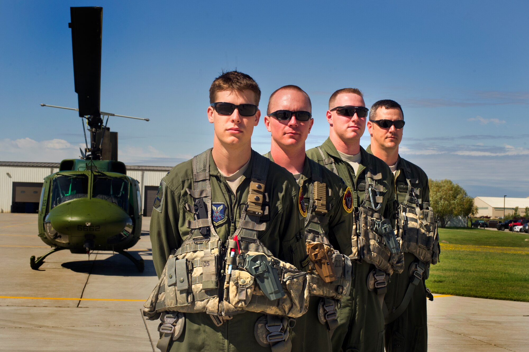 Aircrew members competing in the Global Strike Challenge from the 54th Helicopter Squadron pose for a photo on Minot Air Force Base, N.D., Sept. 3, 2014.The 54th HS team will compete against teams from F.E. Warren AFB, Wyo. and Malmstorm AFB, Mont. for the Bourland Trophy during the Global Strike Challenge.  (U.S. Air Force photo/Senior Airman Brittany Y. Bateman)