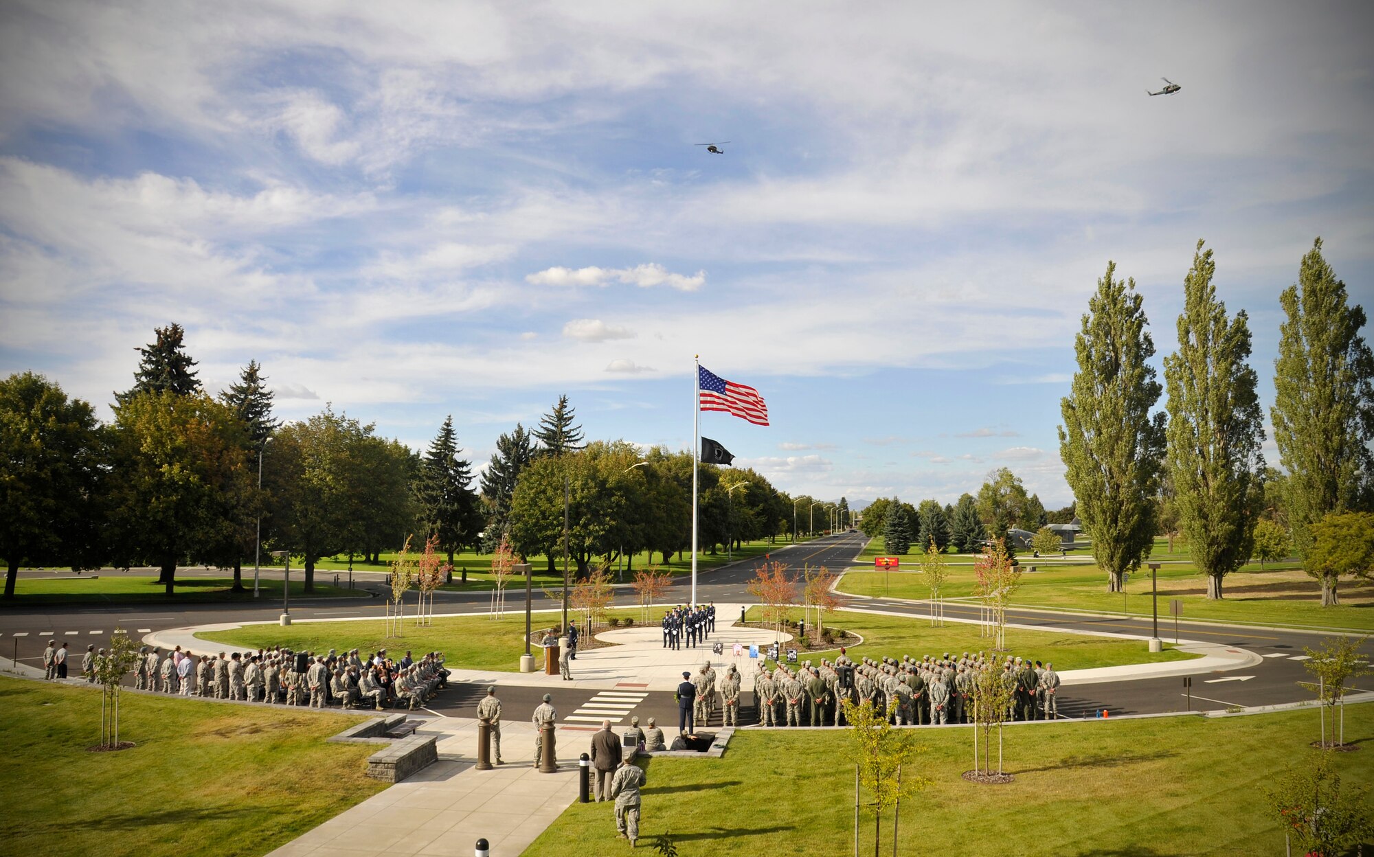Members of Team Fairchild gather for a ceremonial retreat honoring prisoners of war and those missing in action in front of the wing headquarters building at Fairchild Air Force Base, Washington, Sept. 19, 2014. National POW/MIA Recognition Day is a day of observance for all Americans to pause in remembrance of the sacrifices and service of those who were prisoners of war as well as those who are missing in action. (U.S. Air Force photo by Senior Airman Ryan Zeski/Released)