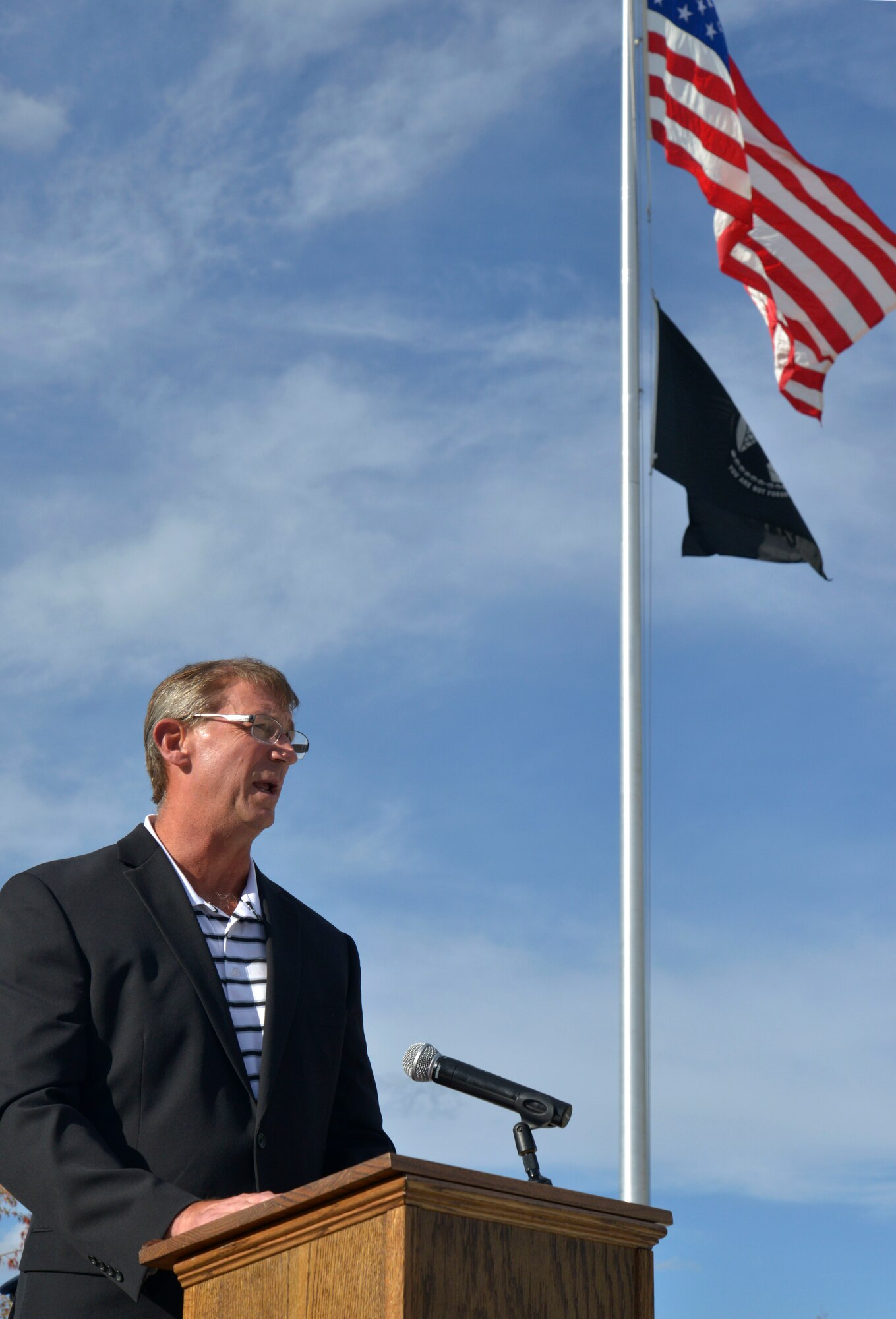U.S. Air Force Lt. Col. (Retired) Dale Storr speaks to members of Team Fairchild during a retreat ceremony honoring prisoners of war and those missing in action at Fairchild Air Force Base, Washington, Sept. 19, 2013. Storr was tortured and held captive for 33 days by Iraqi forces after being shot down over Kuwait during Operation Desert Storm in 1991. (U.S. Air Force photo by Airman 1st Class Janelle Patiño/Released)