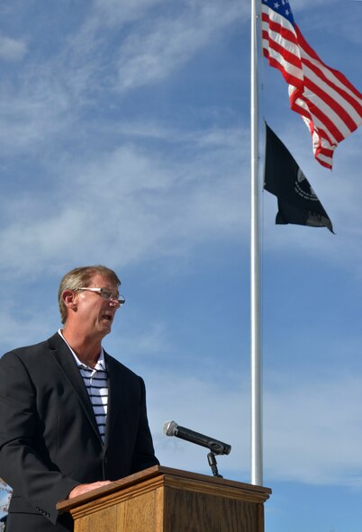 U.S. Air Force Lt. Col. (Retired) Dale Storr speaks to members of Team Fairchild during a retreat ceremony honoring prisoners of war and those missing in action at Fairchild Air Force Base, Washington, Sept. 19, 2013. Storr was tortured and held captive for 33 days by Iraqi forces after being shot down over Kuwait during Operation Desert Storm in 1991. (U.S. Air Force photo by Airman 1st Class Janelle Patiño/Released)