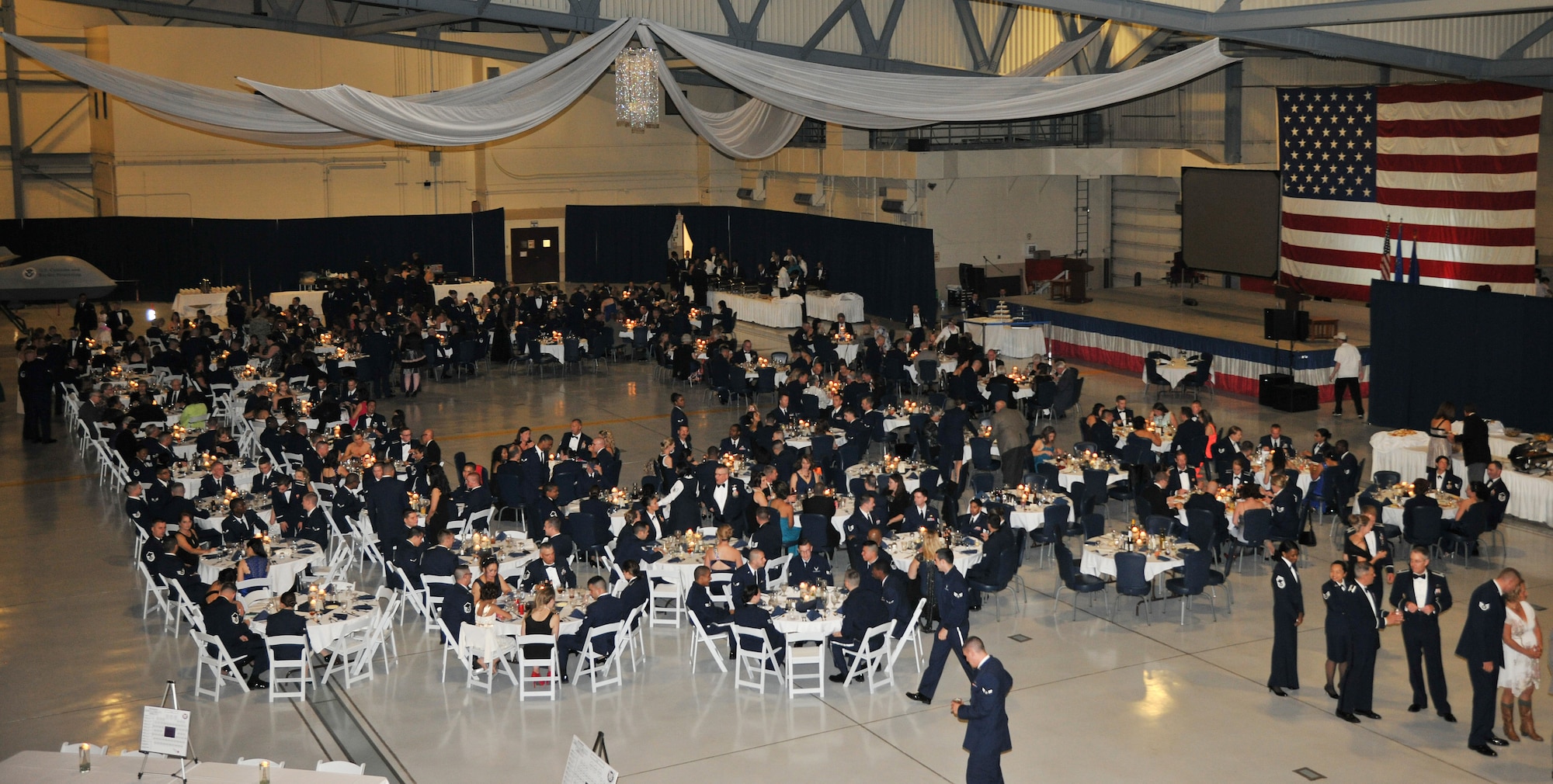 Nearly 500 Grand Forks Airmen attended the 2014 Air Force Ball, themed “Then and Now,” Sept. 19, 2014, at the 3-Bay Hangar on Grand Forks Air Force Base, N.D. The Air Force Ball is an annual Air Force-wide tradition to celebrate the establishment of the Air Force as its own service branch in 1947. (U.S. Air Force photo/Senior Airman Xavier Navarro)