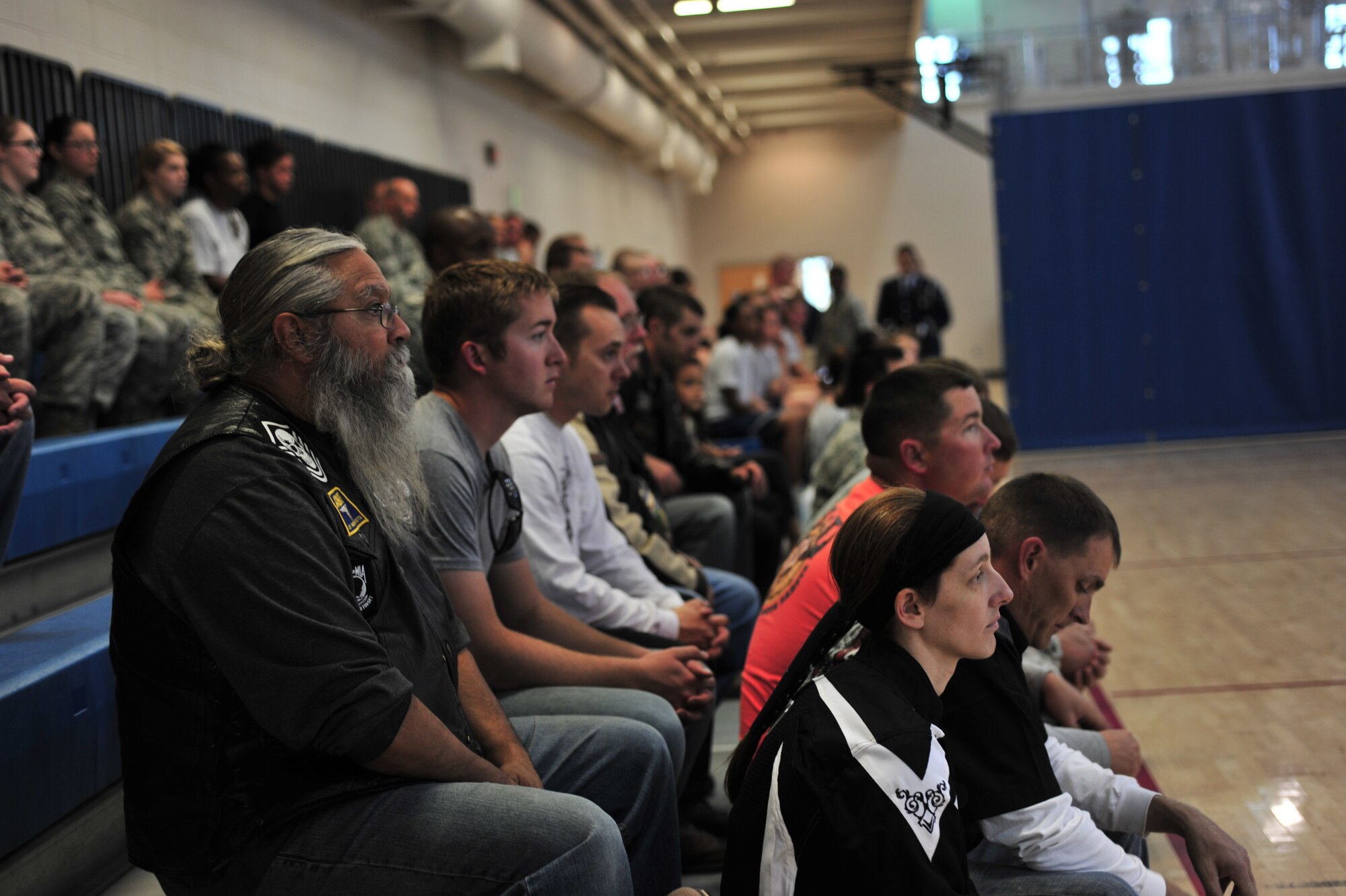 Team Minot and motorcyclists attend the 2014 Prisoner of War and Missing in Action Ceremony on Minot Air Force Base, N.D., Sept. 19, 2014. During the ceremony, Team Minot recognized some of the POWs and MIAs from North Dakota and took a moment of silence in honor of all POWs and MIAs from all five services. (U.S. Air Force photo/Senior Airman Malia Jenkins)