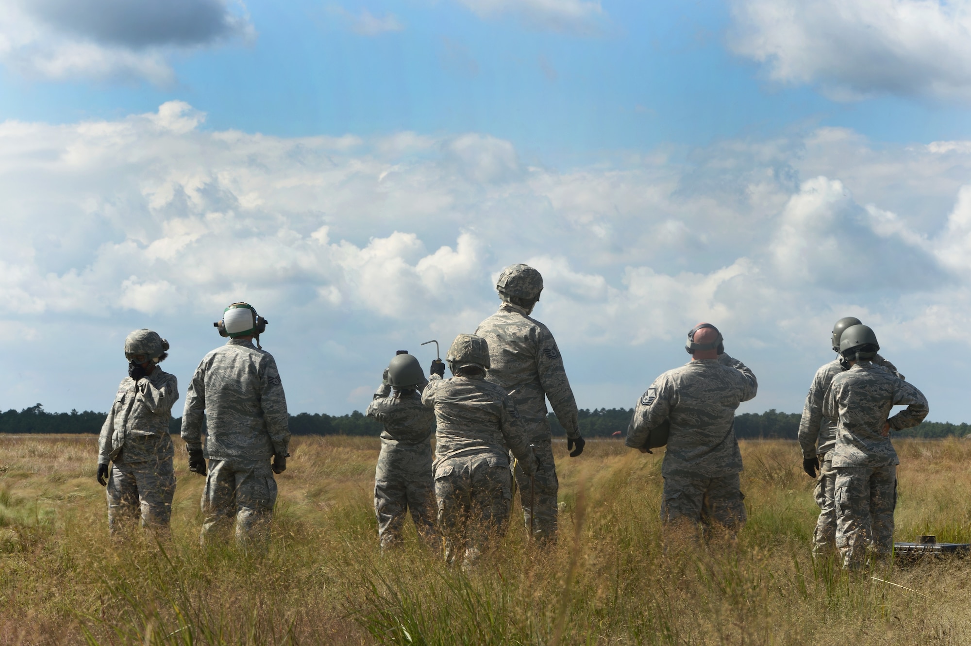 JOINT BASE MCGUIRE-DIX-LAKEHURST, N.J. -- Members of the 621 Contingency Response Wing wait for their simulated cargo to return via a U.S. Army UH-60 Black Hawk helicopter during the revamped sling-load training here, Sept. 16, 2014. The new sling-load training is scheduled to be conducted quarterly. (U.S. Air Force photo by Staff Sgt. Gustavo Gonzalez)