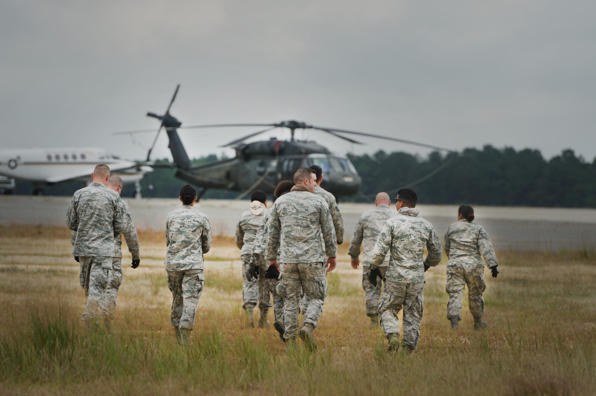JOINT BASE MCGUIRE-DIX-LAKEHURST, N.J. -- Members of the 621st Contingency Response Wing make their way to a U.S. Army UH-60 Black Hawk during the revamped sling-load training here, Sept. 16, 2014. The new sling-load training is scheduled to be conducted quarterly. (U.S. Air Force photo by Staff Sgt. Gustavo Gonzalez)