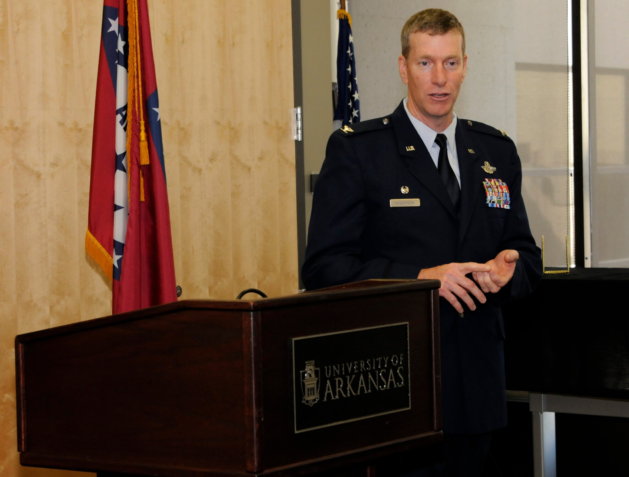 Col. Mark Anderson, 188th Wing commander, addresses a gathering during an Employer Support of the Guard and Reserve Patriot Award presentation held at the University of Arkansas (UA) Center for Multicultural and Diversity Education in Fayetteville, Arkansas, Sept. 19, 2014. Maj. Danielle Wood, 188th Wing Equal Opportunity chief, recognized her employer and supervisors for their support of her Air National Guard career during the event. Dr. Wood is also the UA Office of Equal Opportunity & Compliance director. (U.S. Air National Guard photo by Maj. Heath Allen/Released)