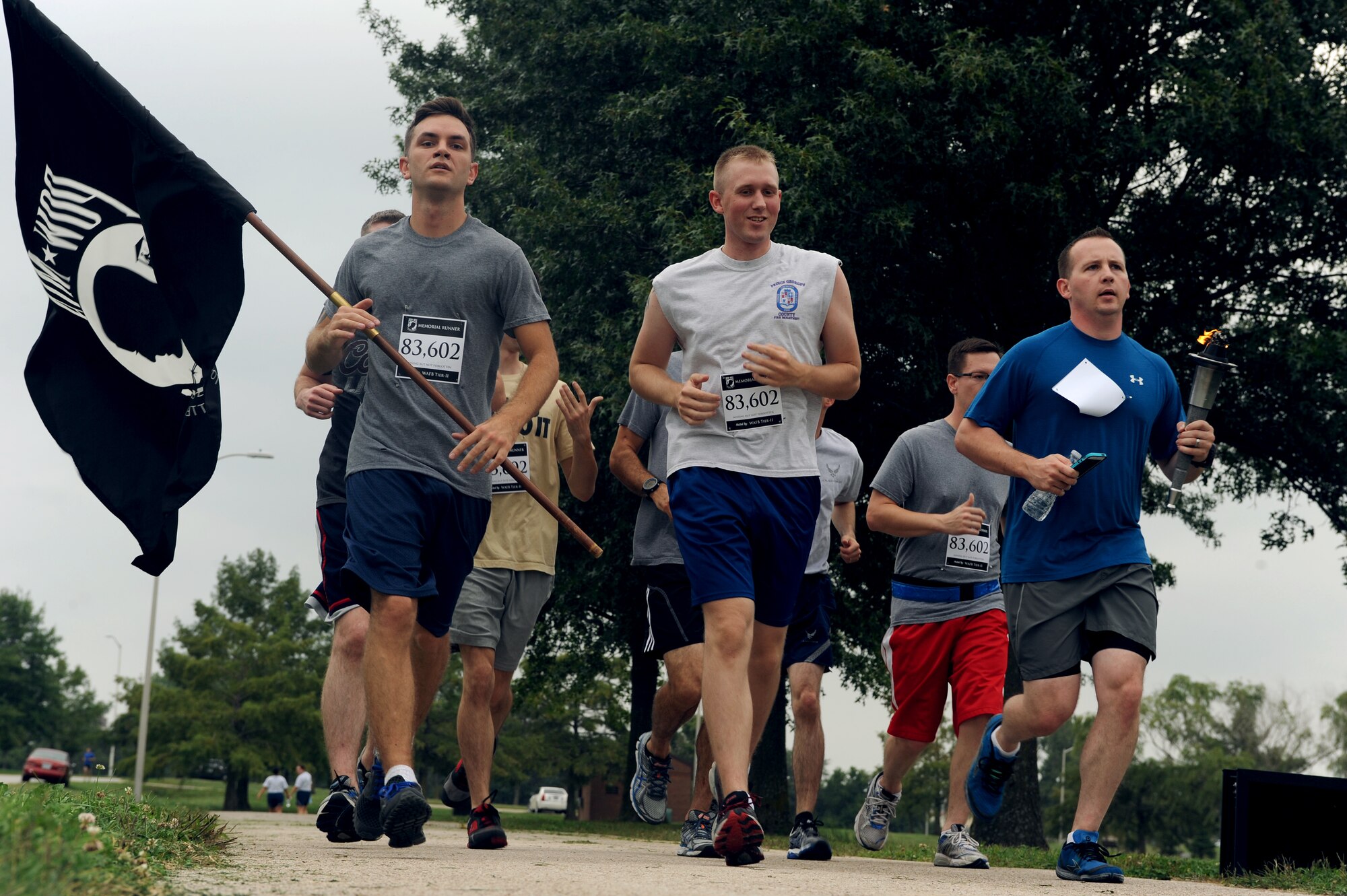 Members of Team Whiteman participate in the annual Prisoners of War/Missing in Action run at Whiteman Air Force Base, Mo., Sept.18, 2014. Approximately 1,500 Airmen from various conflicts are missing from Air Force ranks.  
(U.S. Air Force photo by Airman 1st Class Jovan Banks/Released)
