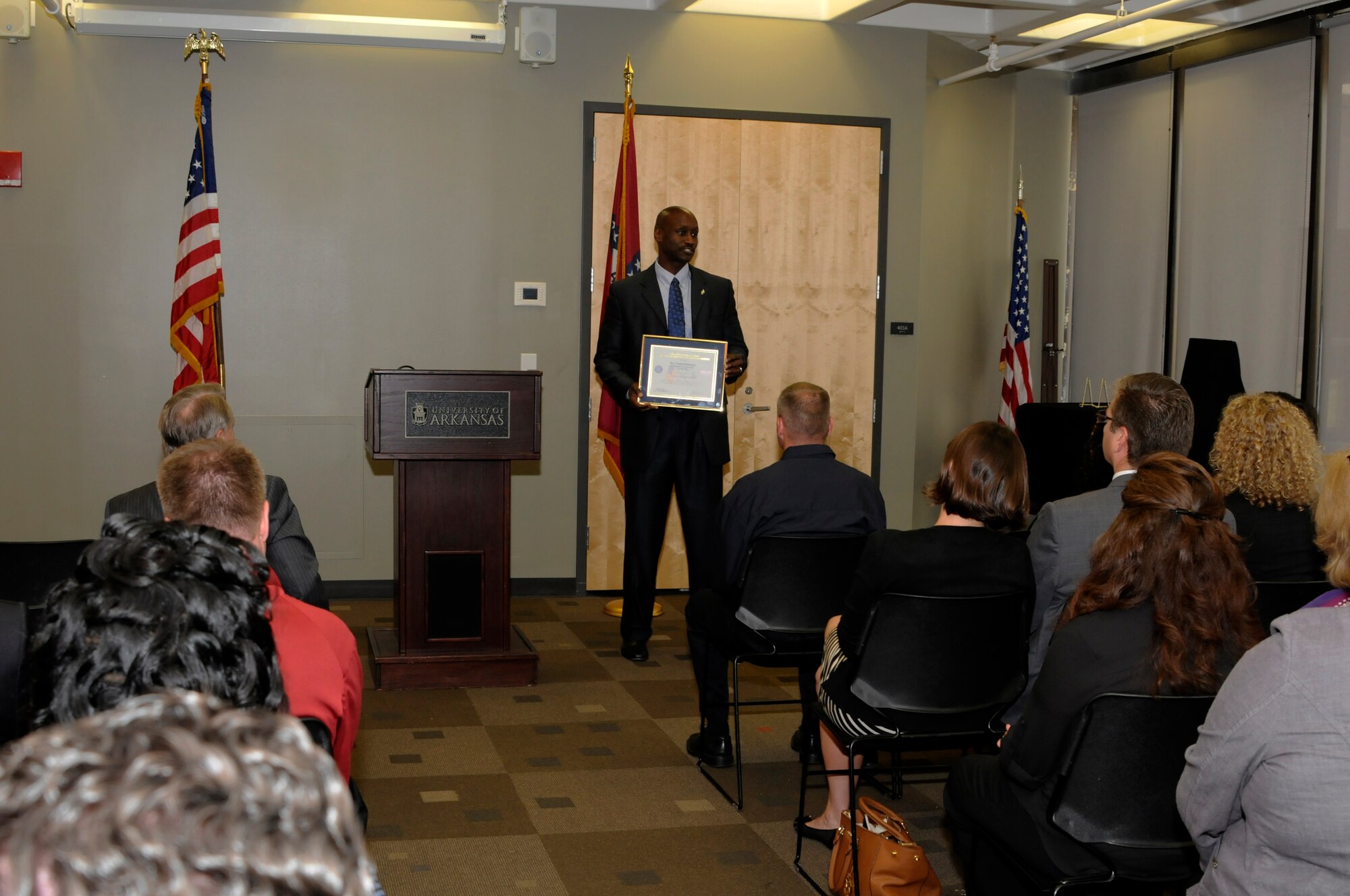 Dr. Charles F. Robinson, University of Arkansas (UA) vice chancellor for diversity and communication, addresses a gathering during an Employer Support of the Guard and Reserve Patriot Award presentation held at the UA Center for Multicultural and Diversity Education in Fayetteville, Arkansas, Sept. 19, 2014. Maj. Danielle Wood, 188th Wing Equal Opportunity chief, recognized the UA, Robinson and Dr. G. David Gearhart, UA chancellor, for their support of her Air National Guard career during the event. Dr. Wood is also the UA Office of Equal Opportunity & Compliance director. (U.S. Air National Guard photo by Maj. Heath Allen/Released)  