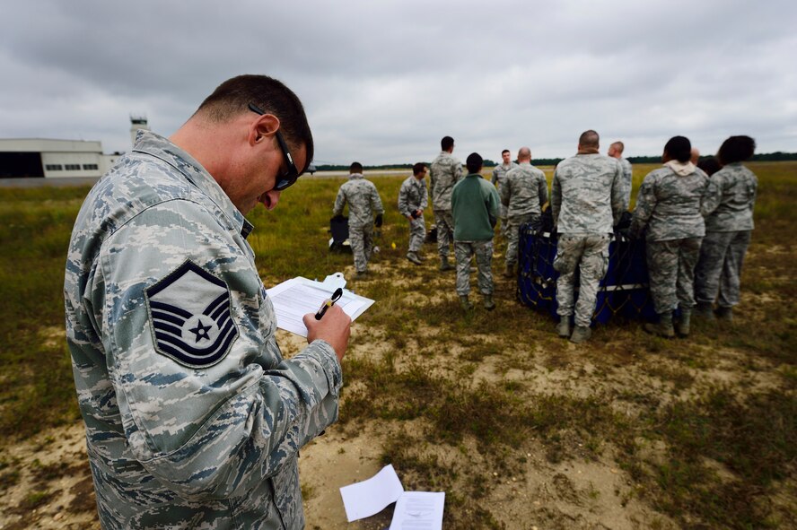 JOINT BASE MCGUIRE-DIX-LAKEHURST, N.J. -- Master Sgt. Eric Sullivan, 621 Contingency Response Wing sling-load course instructor, reviews a checklist during the revamped sling-load training here, Sept. 16, 2014. The new sling-load training is scheduled to be conducted quarterly. (U.S. Air Force photo by Staff Sgt. Gustavo Gonzalez)