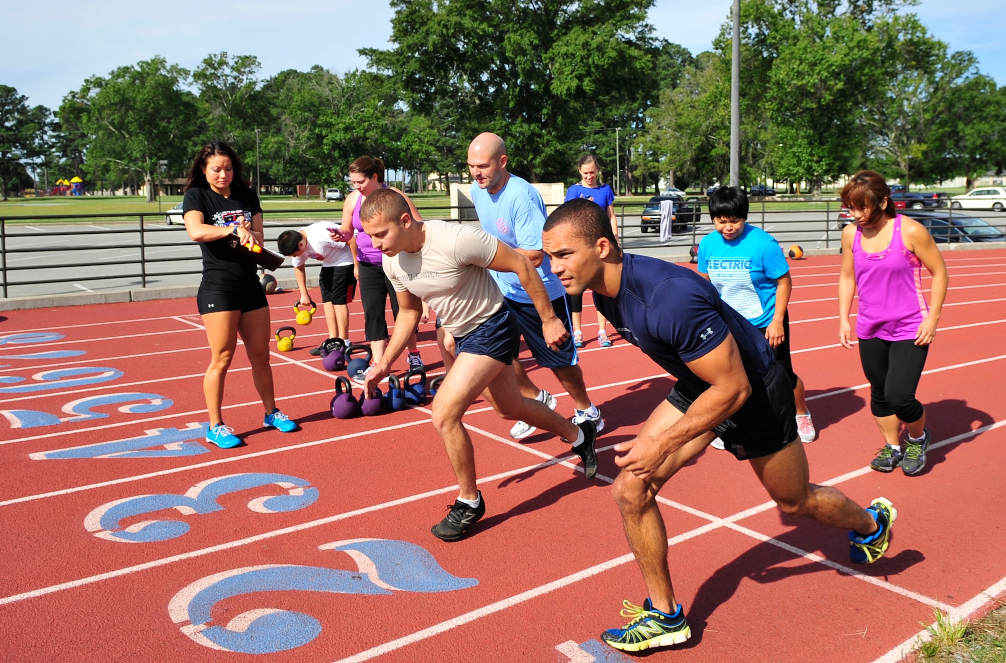 Participants of the 2014 Combat Fitness Challenge tear up the track at Seymour Johnson Air Force Base, North Carolina, Sept. 20, 2014. The Combat Fitness Challenge is an advanced circuit-style fitness course focusing on strength and cardiovascular fitness. (U.S. Air Force photo/Airman 1st Class Shawna L. Keyes)