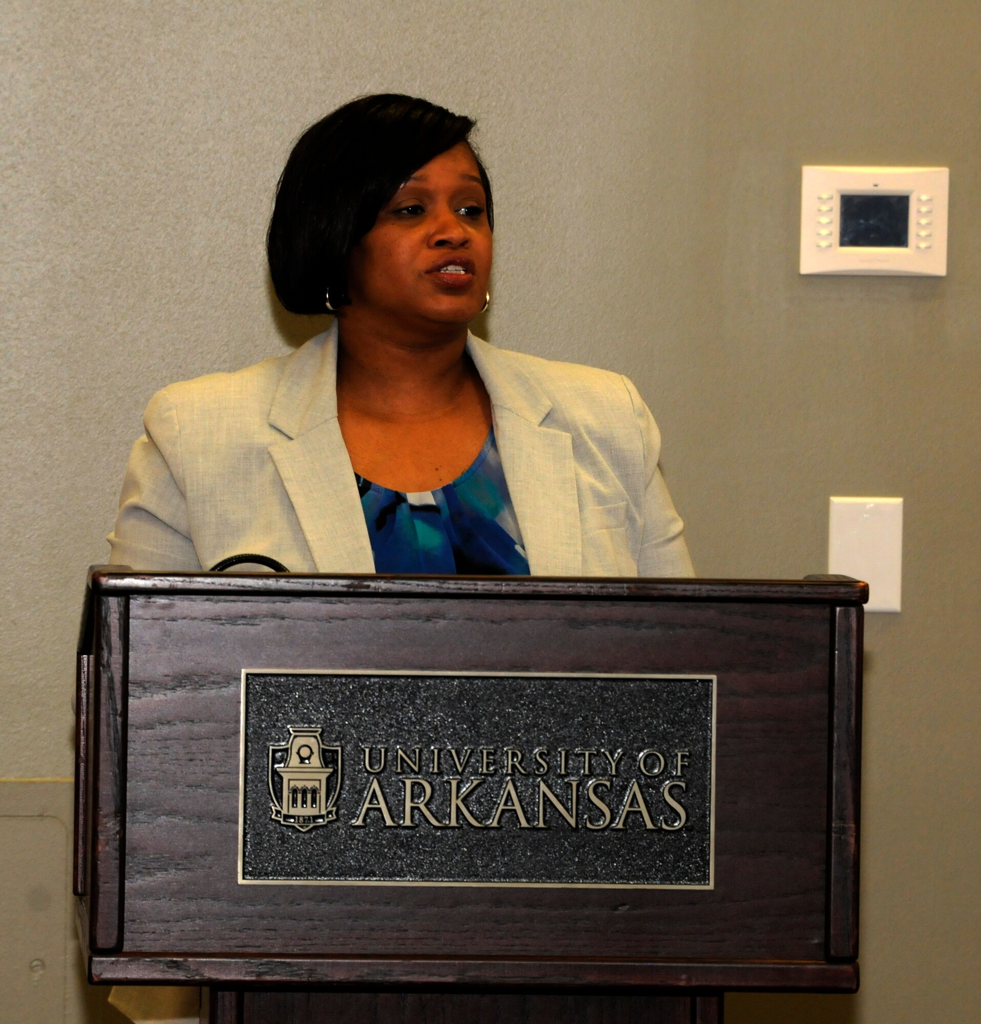 Maj. Danielle Wood, 188th Wing Equal Opportunity chief, addresses a gathering during an Employer Support of the Guard and Reserve Patriot Award presentation held at the University of Arkansas Center for Multicultural and Diversity Education in Fayetteville, Arkansas, Sept. 19, 2014. Wood recognized her employer and supervisors for their support of her Air National Guard career during the event. Dr. Wood is also the UA Office of Equal Opportunity & Compliance director.  (U.S. Air National Guard photo by Maj. Heath Allen/Released) 