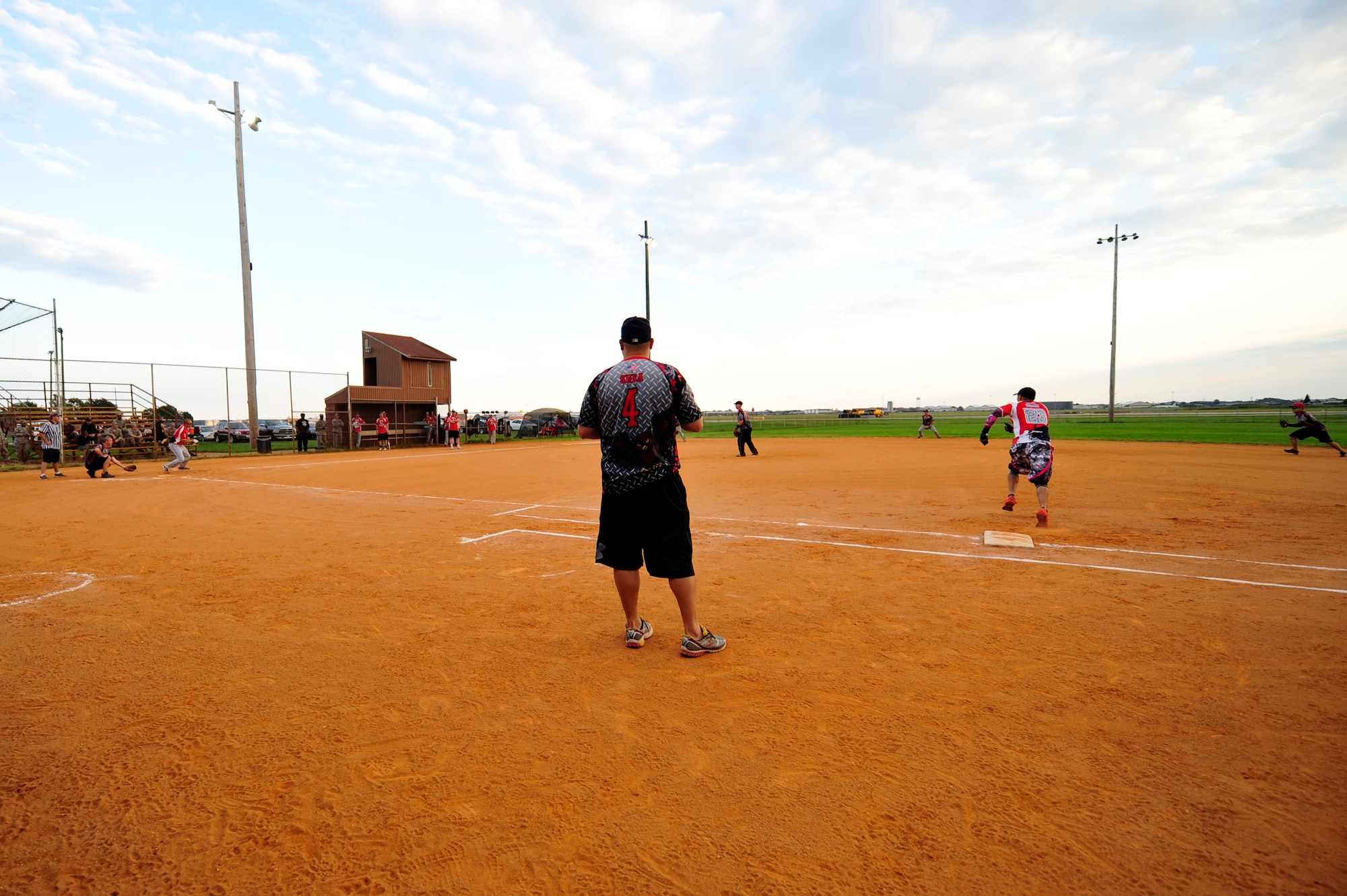 Joseph Sirois, 45th Intelligence Squadron coach, watches his team’s offense during the Intramural Softball Championship at Langley Air Force Base, Va., Sept. 18, 2014. Although both teams were undefeated throughout the season, the 45th IS lost to the 633rd Civil Engineer Squadron, 18 to 25. (U.S. Air Force photo by Airman 1st Class Breonna Veal/Released) 