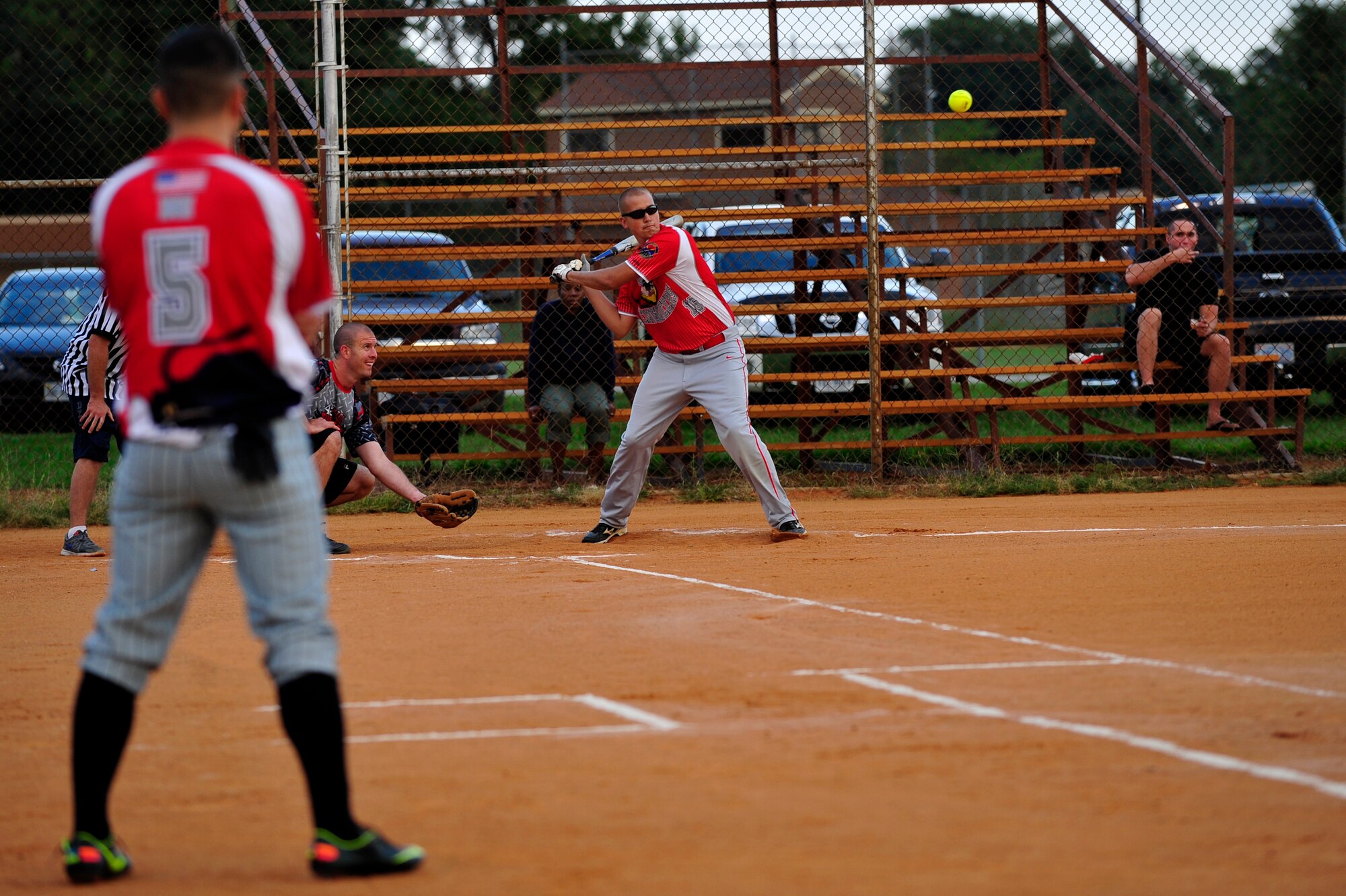 U.S. Air Force Staff Sgt. Nathan Hupp, 633rd Civil Engineer Squadron batter, takes a swing at a softball during the Intramural Softball Championship at Langley Air Force Base, Va., Sept. 18, 2014. The 633rd CES team won the championship against the 45th Intelligence Squadron team, 25 to 18. (U.S. Air Force photo by Airman 1st Class Breonna Veal/Released)