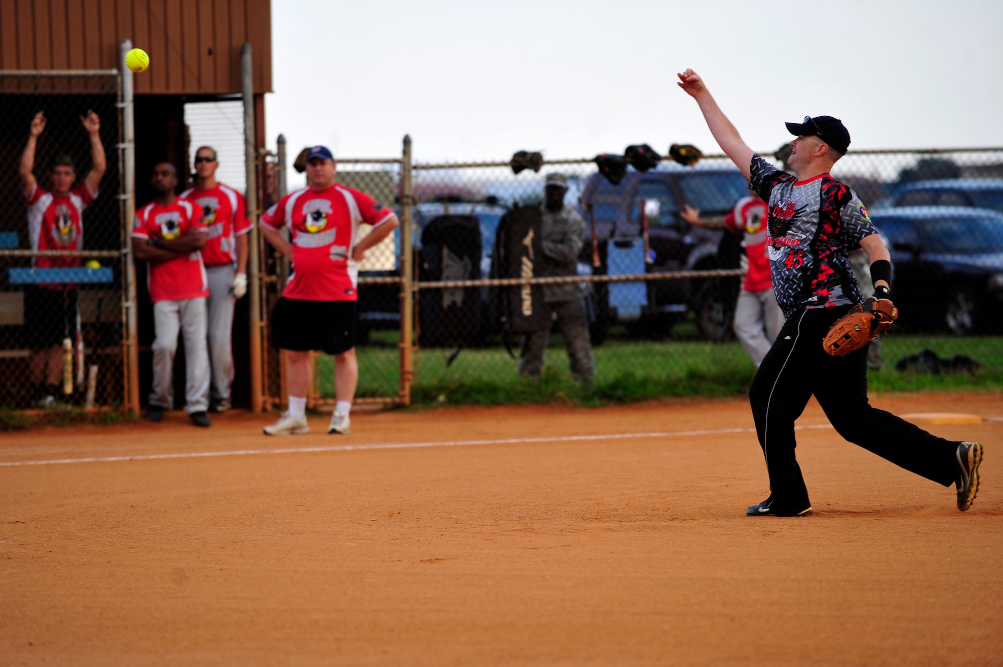 The 45th Intelligence Squadron’s pitcher throws a softball during the Intramural Softball Championship at Langley Air Force Base, Va., Sept. 18, 2014.  Thirteen teams competed to become this year’s softball season champions.  (U.S. Air Force photo by Airman 1st Class Breonna Veal/Released)
