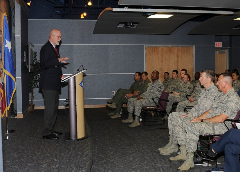 Mr. Michael Johnson, associate vice chancellor for Facilities at the University of Arkansas, speaks to Arkansas National Guardsmen from the 188th Wing about diversity in equality, behavior, change and leadership at Ebbing Air National Guard Base, Fort Smith, Arkansas on Sept. 7, 2014. During his speech, Johnson challenged Airmen to focus on people and to value and cherish the diversity at the 188th Wing. Johnson is also a retired active duty rear admiral from the U.S. Navy. (U.S. Air National Guard photo by Staff Sgt. Hannah Landeros/released)