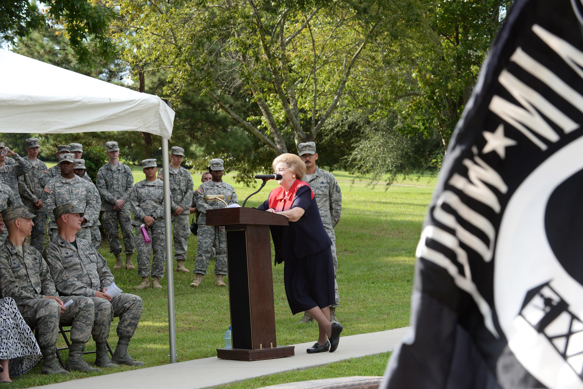 Beverly Mims, wife of Capt. George Mims Jr., an Airman who was first declared missing in action, then affirmed killed in action during the Vietnam War, spoke to the Airmen, soldiers, and veterans attending the POW/MIA Remembrance Day ceremony at Memorial Lake at Shaw Air Force Base, S.C., Sept. 19, 2014. Mims’ husband, who was a weapons system operator in a McDonnell Douglas F-4C Phantom II, was flying cover patrol for a mission when his aircraft took a direct hit from a surface to air missile. (U.S. Air Force photo by Airman 1st Class Diana M. Cossaboom/Released)