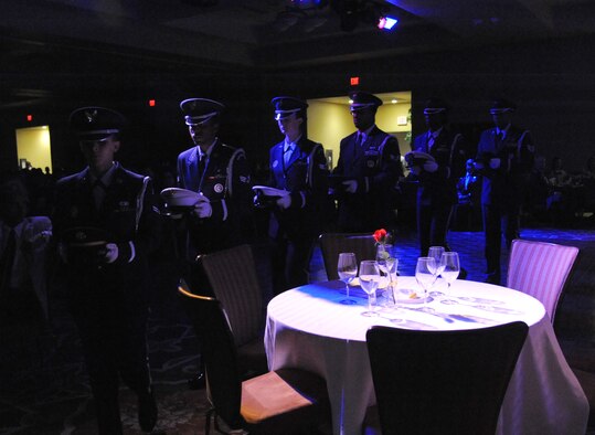 Members of the Keesler Honor Guard perform a Prisoner of War/Missing in Action table ceremony during the Air Force’s 67th Birthday Ball on Sept. 20, 2014, at the Bay Breeze Event Center, Keesler Air Force Base, Miss. The event, sponsored by the Air Force Association John C. Stennis Chapter #332, also commemorated the 50th anniversary of the Vietnam War. (U.S. Air Force photo by Kemberly Groue)