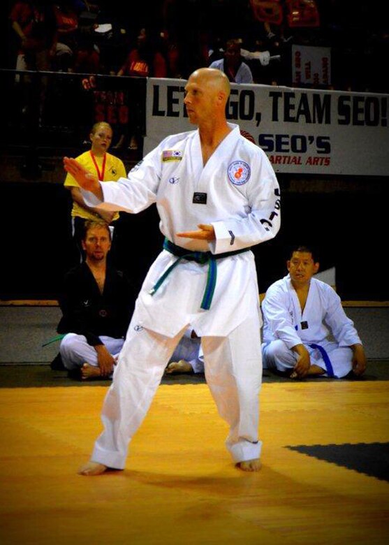 Master Sgt. Stephen Wall, 43rd Logistics Readiness Squadron, competes at the 6th annual U.S. Open Taekwondo Hanmadang competition in Colorado Springs, Colorado. Wall won gold medals in the three events he competed in, creative and power breaking and traditional forms. His son Kelan, 7, competed in four events and won gold medals in creative breaking and forms, a silver medal in traditional pairs and a bronze medal in traditional forms. There were a total of 1,600 competitors from 26 states and South Korea in this year’s two-day competition. (Courtesy photo/Melissa Wall)
