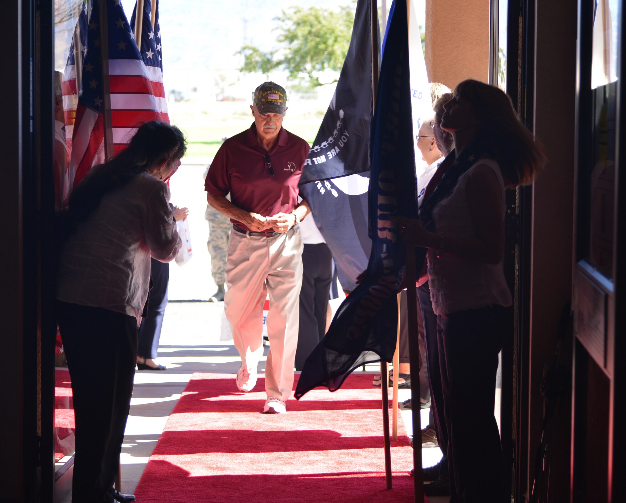 Vietnam veteran Robert Martinez walks the red carpet as he enters the Mountain View Club for a luncheon commemorating the 50th anniversary of the Vietnam War. Martinez was one of 70 veterans recognized and honored at the event.  (Photo by Todd Berenger)