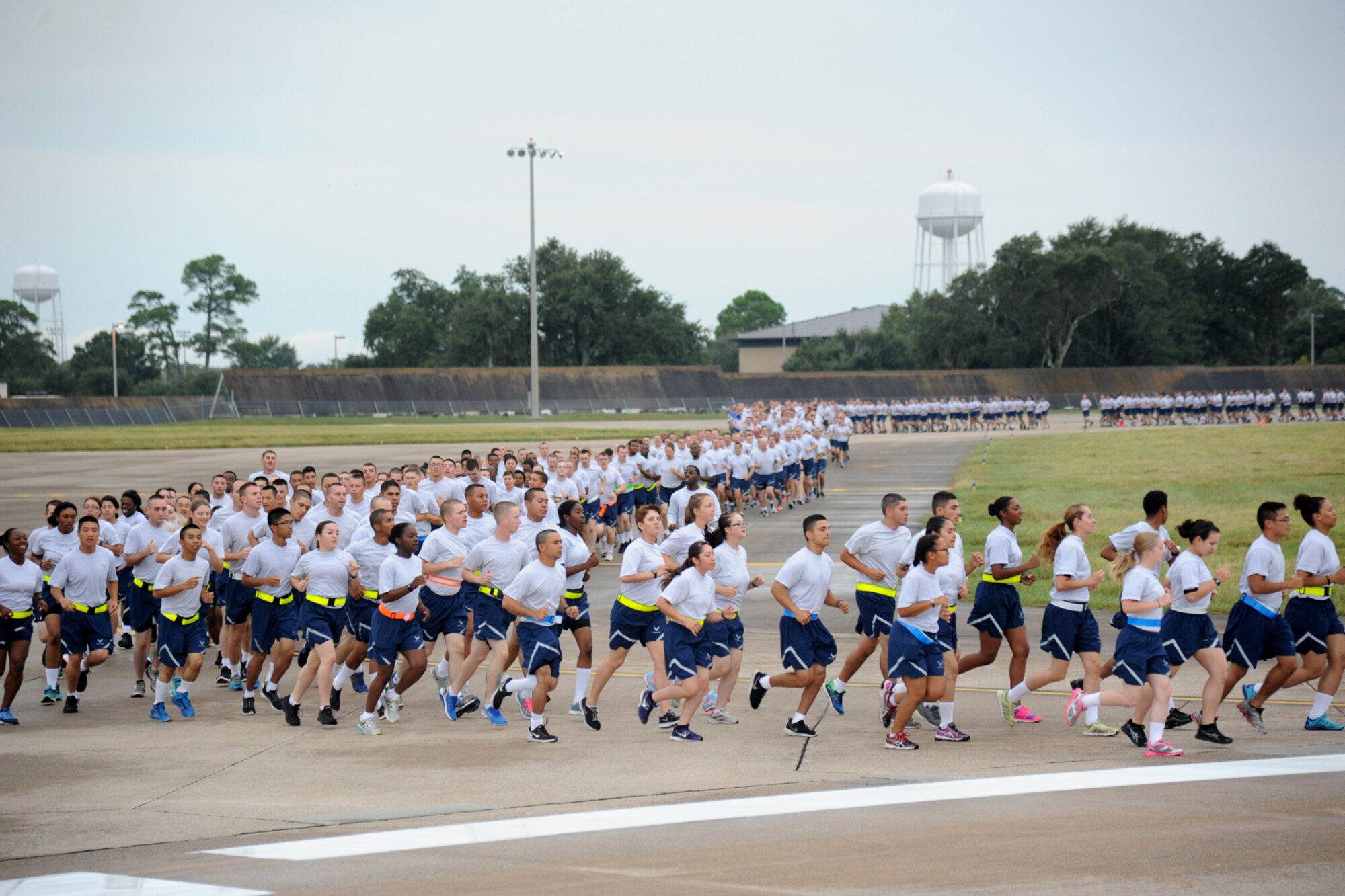 Keesler Airmen run around the flight line during a 5K run Sept. 19, 2014.  The run was the kickoff event for a day of activities in support of Wingman Day.  (U.S. Air Force photo by Kemberly Groue)