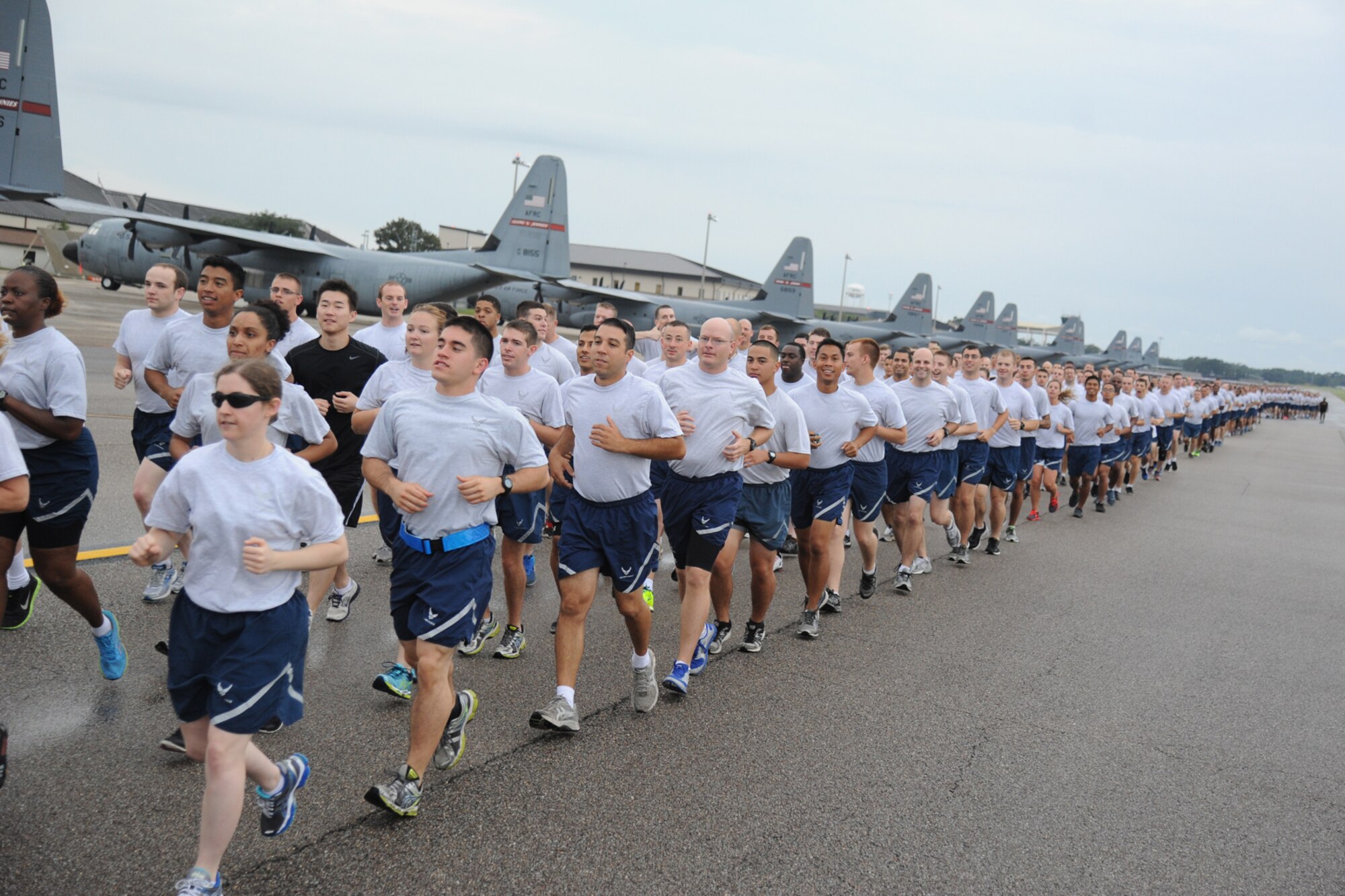 Keesler Airmen run around the flight line during a 5K run Sept. 19, 2014.  The run was the kickoff event for a day of activities in support of Wingman Day.  (U.S. Air Force photo by Kemberly Groue)