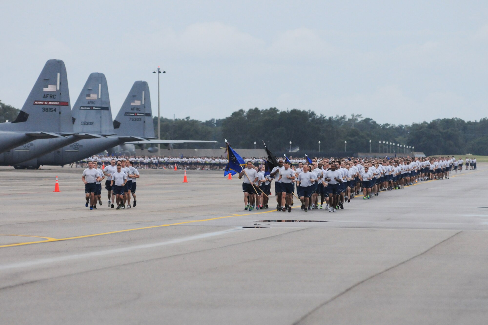 Leadership from the 81st Training Wing leads Keesler personnel around the flight line during a 5K run Sept. 19, 2014.  The run was the kickoff event for a day full of activities supporting Wingman Day.  (U.S. Air Force photo by Kemberly Groue)