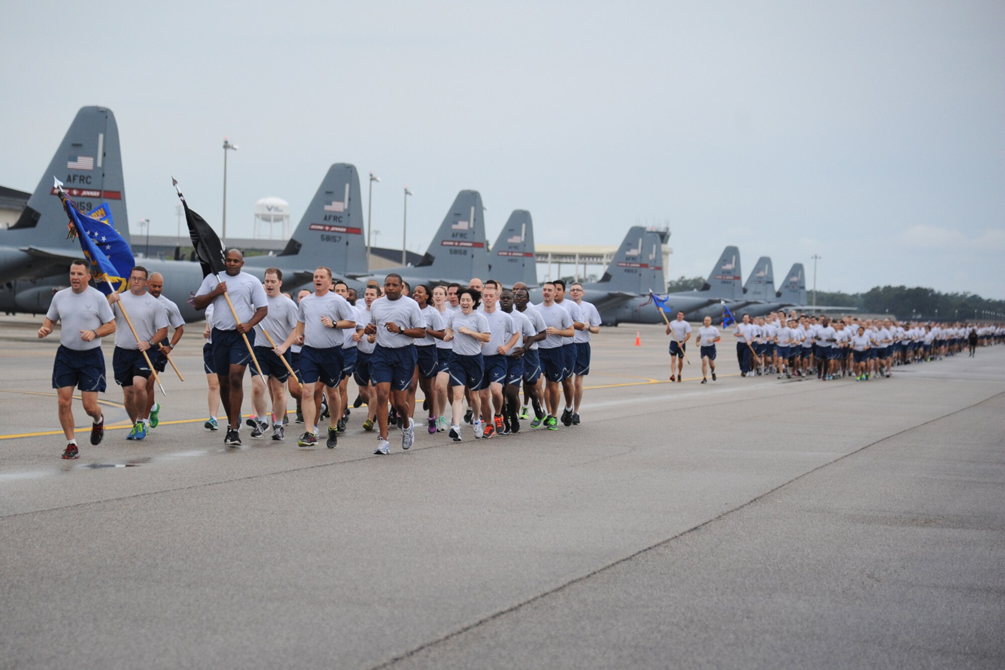 Leadership from the 81st Training Wing leads Keesler personnel around the flight line during a 5K run Sept. 19, 2014.  The run was the kickoff event for a day full of activities supporting Wingman Day.  (U.S. Air Force photo by Kemberly Groue)