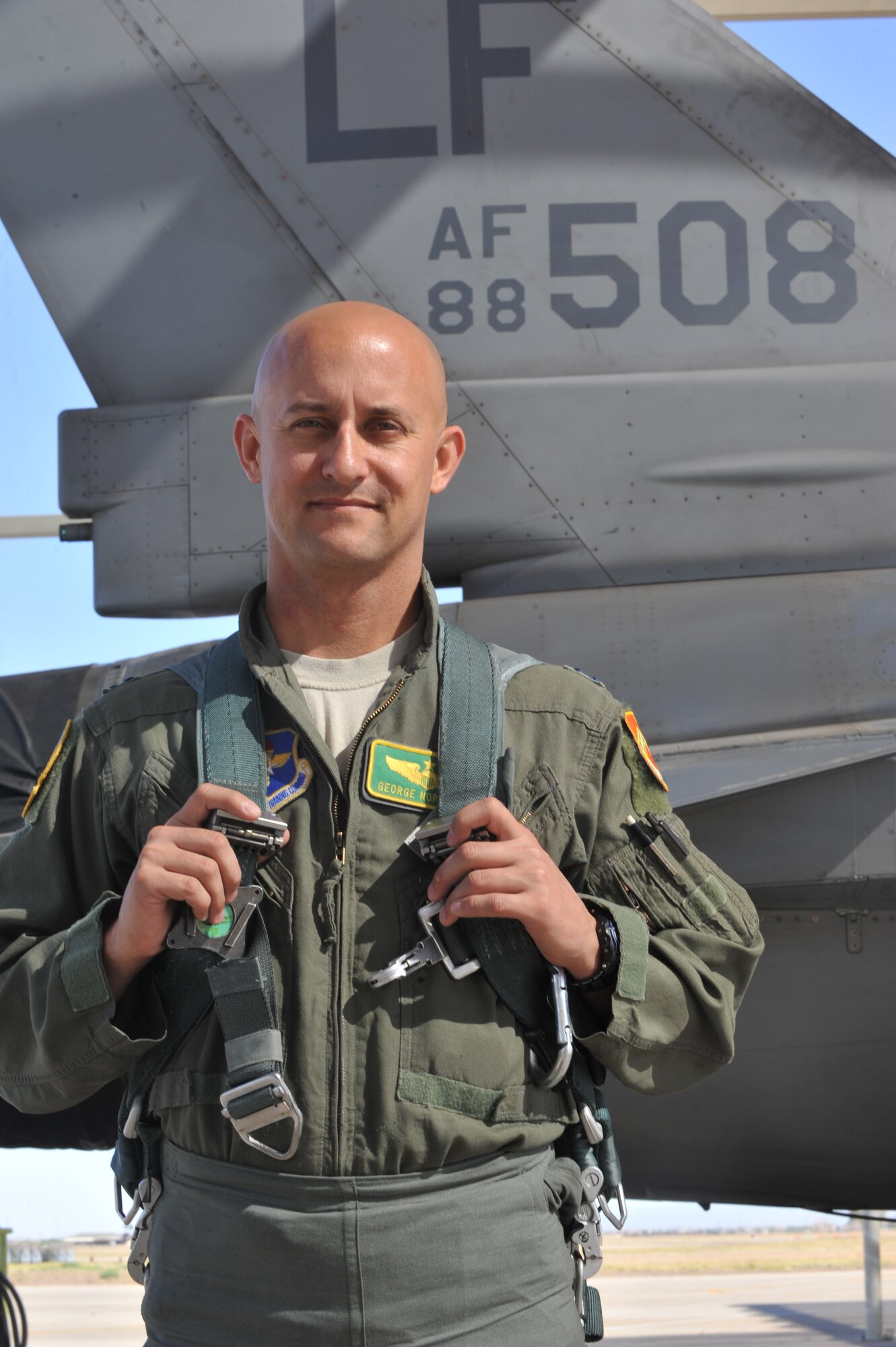 Capt. George Normandin, 56th Fighter Wing Command Post chief, received the Aviation Safety Well Done Award Sept. 2, presented by Brig. Gen. Scott Pleus, 56th FW commander. Normandin took control of an F-16 Fighting Falcon and landed it safely after an internal malfunction occurred during a training mission over Luke. (U.S. Air Force photo//Senior Airman Marcy Copeland)