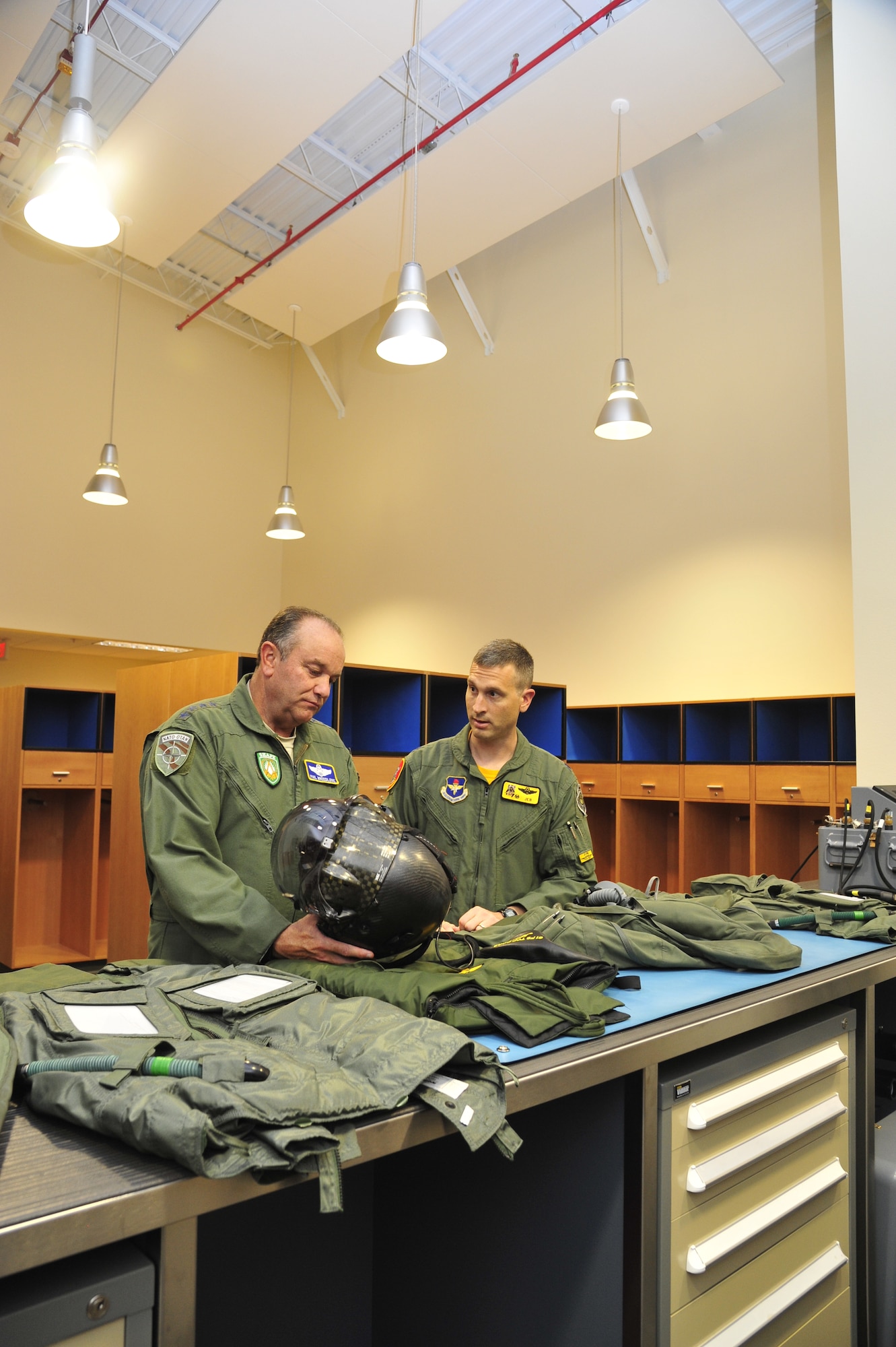Breedlove looks at the new helmet pilots will be wearing when flying the F-35 while Lt. Col. Michael Ebner, 61st Fighter Squadron commander, talks about the helmet’s features. Breedlove toured the newly built facility viewing the vault, heritage room and more. (U.S. Air Force photo/Senior Airman Grace Lee)