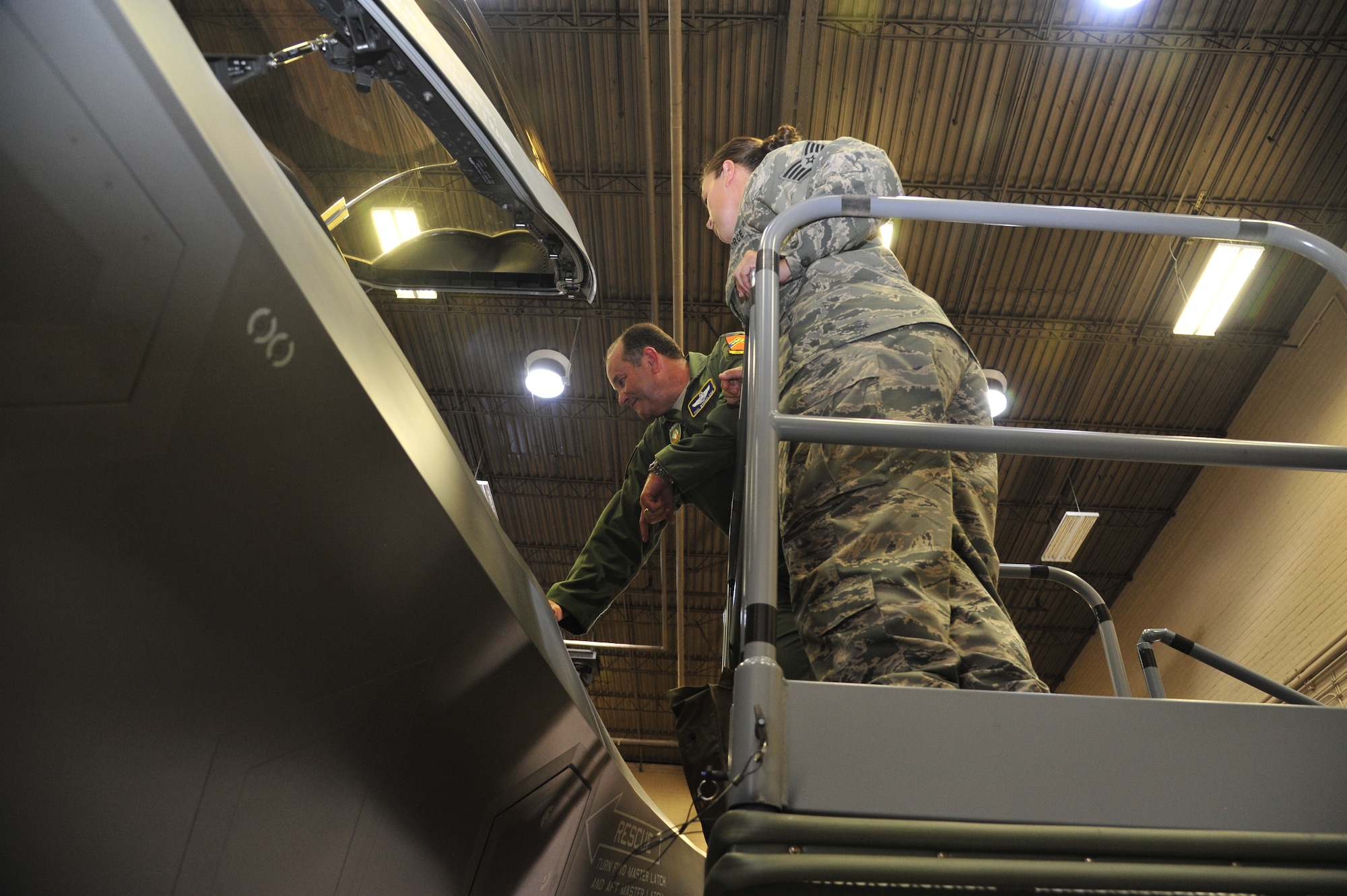 Breedlove looks inside the cockpit of the fifth-generation aircraft in the academic training facility. Airmen from the 61st AMU answered questions and talked specifics about the F-35 Lightning II JSF. (U.S. Air Force photo/Senior Airman Grace Lee)