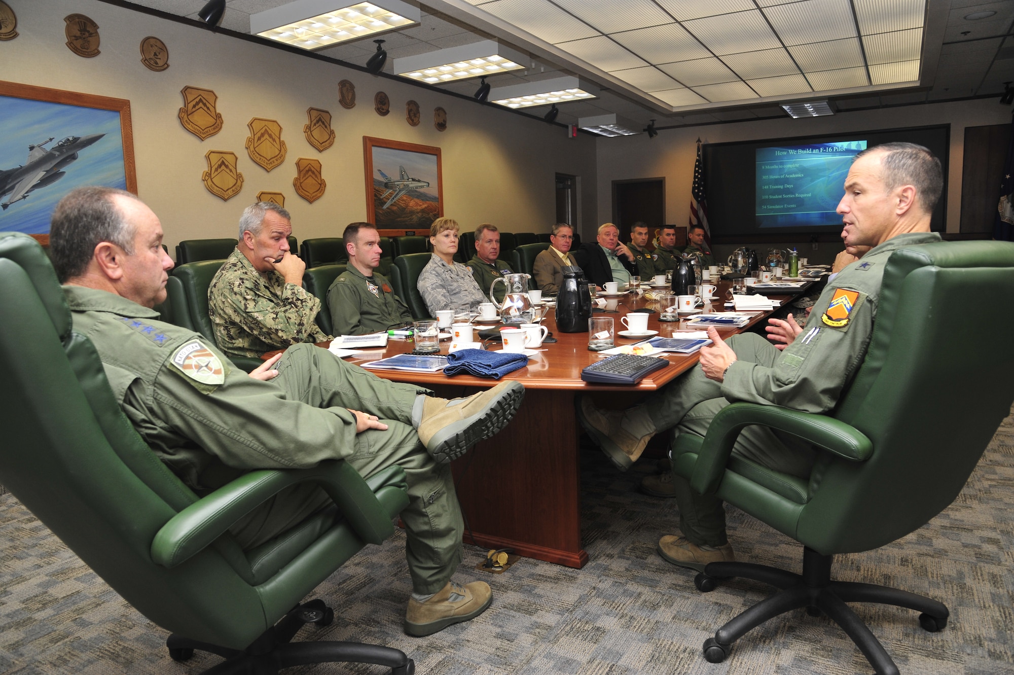 Gen. Philip Breedlove, left, NATO supreme allied commander, Europe, visited Luke Air Force Base Sept. 12. Brig. Gen. Scott Pleus, right, 56th Fighter Wing commander, briefed the general on Luke’s evolving mission to train F-35 Lightning II joint strike fighter pilots and F-16 Fighting Falcon fighter pilots. (U.S. Air Force photo/Senior Airman Grace Lee)